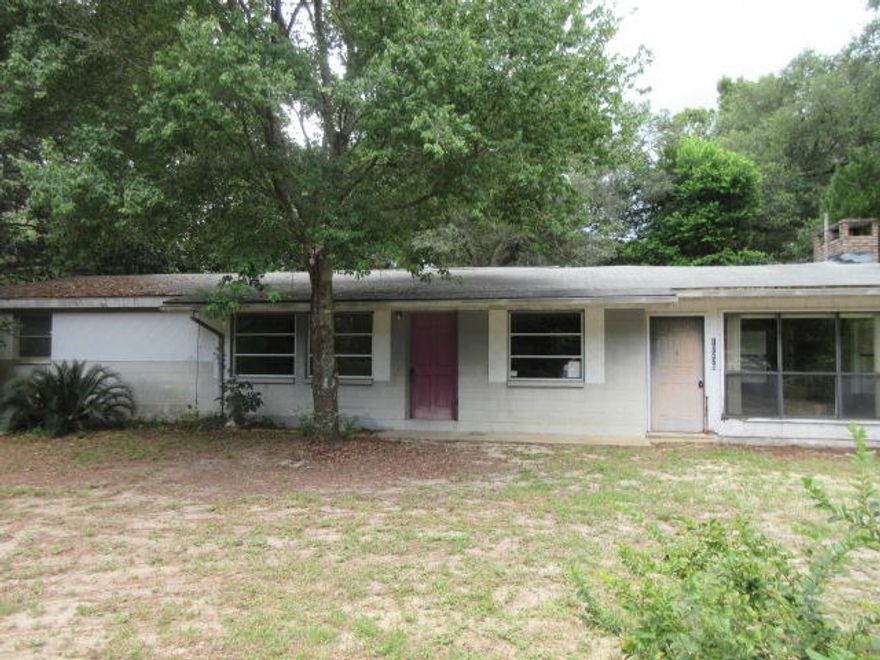 Great location for this 2 bedroom, 1 bath REO home on a 1/2 acre lot! The home sits on a corner lot directly across the street from the Bay. There are so many possibilities for this cute homeand with a little love it could be the perfect residence or rental investment. The home features a wood burning fireplace, fenced lot and plenty of room to grow. The location is close to the bay, schools, employment opportunities and a short drive to all the Resorts have to offer.