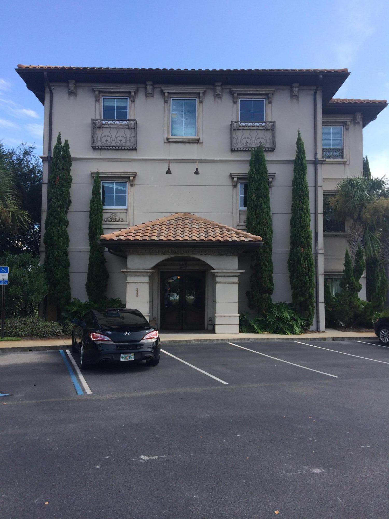 3-story stucco building with numerous details/tile roof and approx. 150' of frontage on Emerald Coast Pkwy is perfect for any professional/medical office space. 23 parking spaces. The office space is on the ground floor with a large detailed wooden door entrance. The office space has a wood flooring throughout. The front space has a large reception desk with detailed cabinets/granite tops. There is a large conference room with chandelier & can lighting overlooking Regatta Bay golf course. There is three other large offices with carpet flooring. Kitchen area with refrigerator, microwave, cabinets and granite tops. Printer/Supply room with cabinets/granite tops. Very nice bathroom and extra storage space. Tenant pays all utilities with owner paying maintenance, taxes and insurance.