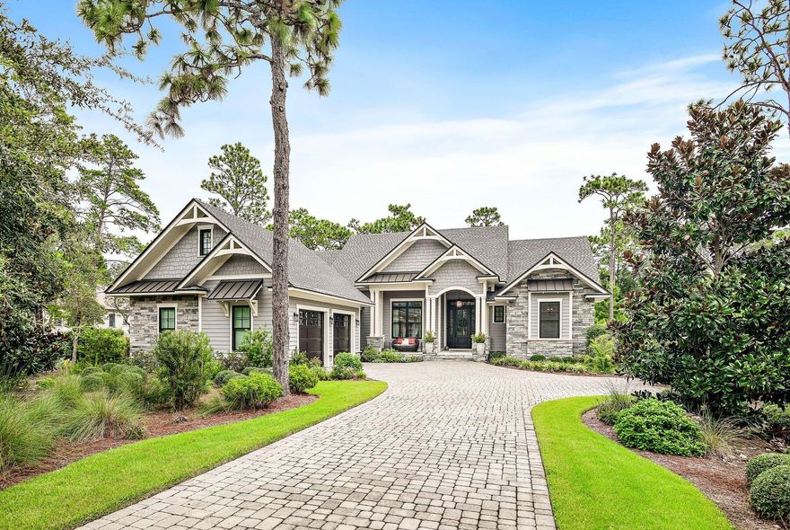 Under Contract taking back up offers. Just a long putt from Shark's Tooth Clubhouse in beautiful Wild Heron, this sleek Craftsman-style home is a harmonious mix of rustic character and coastal luxury located on the 10th fairway. Built to the highest standards and offered fully furnished, it has instant appeal as a second home. Beyond the grand custom wood front door, natural daylight bathes every room while the outdoor living space seamlessly integrates into the surrounding landscaping. Designed to embrace peaceful outdoor living and laid-back entertaining, the 0.34-acre lot includes a heated pool and a fully equipped outdoor kitchen with a built-in grill and beverage fridge. There's an extensive outdoor lounge area for sitting back and enjoying it all. Check out the dual-sided gas fireplace with fireballs, the fire pit for star-gazing, a vibrant flower garden and natural foliage providing additional privacy. The front porch is designed for relaxing on the delightful cocoon sofa and savoring west-facing views of mature trees and sunset skies. A nature pond across the street attracts additional birds and wildlife. The back porch is perfect for sipping morning coffee and admiring those sunrise views. The open floorplan offers a natural flow through this well-lit living space with 10-foot ceilings and gleaming hardwood flooring leading into a designated dining area. A large wood-clad gas fireplace adds character to the great room, along with multiple columns, beams, mantles, accent walls and a sliding barn door to the laundry, all made from reclaimed wood. The custom-built kitchen is a chef's dream with high-quality Bosch appliances, gorgeous quartz countertops and full-height white custom cabinets boasting soft-close doors and drawers. The central island provides a space to perch and chat, and a walk-in pantry keeps everything tidy. This bijou residence has a split floor plan offering a first-floor master suite with a custom walk-in California closet and a dreamy bathroom complete with a copper soaking tub and zero-entry shower. Two additional guest bedrooms share a Jack-and-Jill bath, and another second-floor bedroom has an immaculate ensuite. The owners have made several noteworthy improvements, including additional landscaping, privacy hedges and enhanced irrigation. A whole house generator and pool heater were added recently, along with new garage doors of the spacious two-and-a-half-car garage with a designated spot for a golf cart. New furniture includes a dining set, accent chairs and sofas, two bedroom suites with mattresses, and an M7 Sleep Number flex bed in the master suite. Architectural plans for a screened enclosure will convey with the sale, if required. Conveniently close to 30A restaurants, boutiques and Rosemary Beach attractions, this mint-condition home enjoys all the benefits of Wild Heron amenities. The 734-acre coastal community has gated security, a playground, fire pit, heated pool and a hot tub. Live events include concerts, a farmers' market, a kids' movie night and food trucks. The fully equipped fitness center and 24 miles of pet-friendly walking/biking trails make exercise a pleasure, while the fully stocked boathouse allows owners to immerse themselves in nature on kayaks and paddleboards to the gulf's beautiful white sandy beach. There's also a new dock and marina with boat slips and a public boat launch that is only a few minutes away. The new golf course on the north and east ends, connecting to Watersound Origins is sure to increase property values. Optional private membership to WaterSound Beach Club opens the door to three exclusive golf courses, tennis, beachfront pools, a shooting center, and dining.  Buyer to verify all data and dimensions if important.  See full list of additions and specifications in the Documents.  Call today for a showing!
