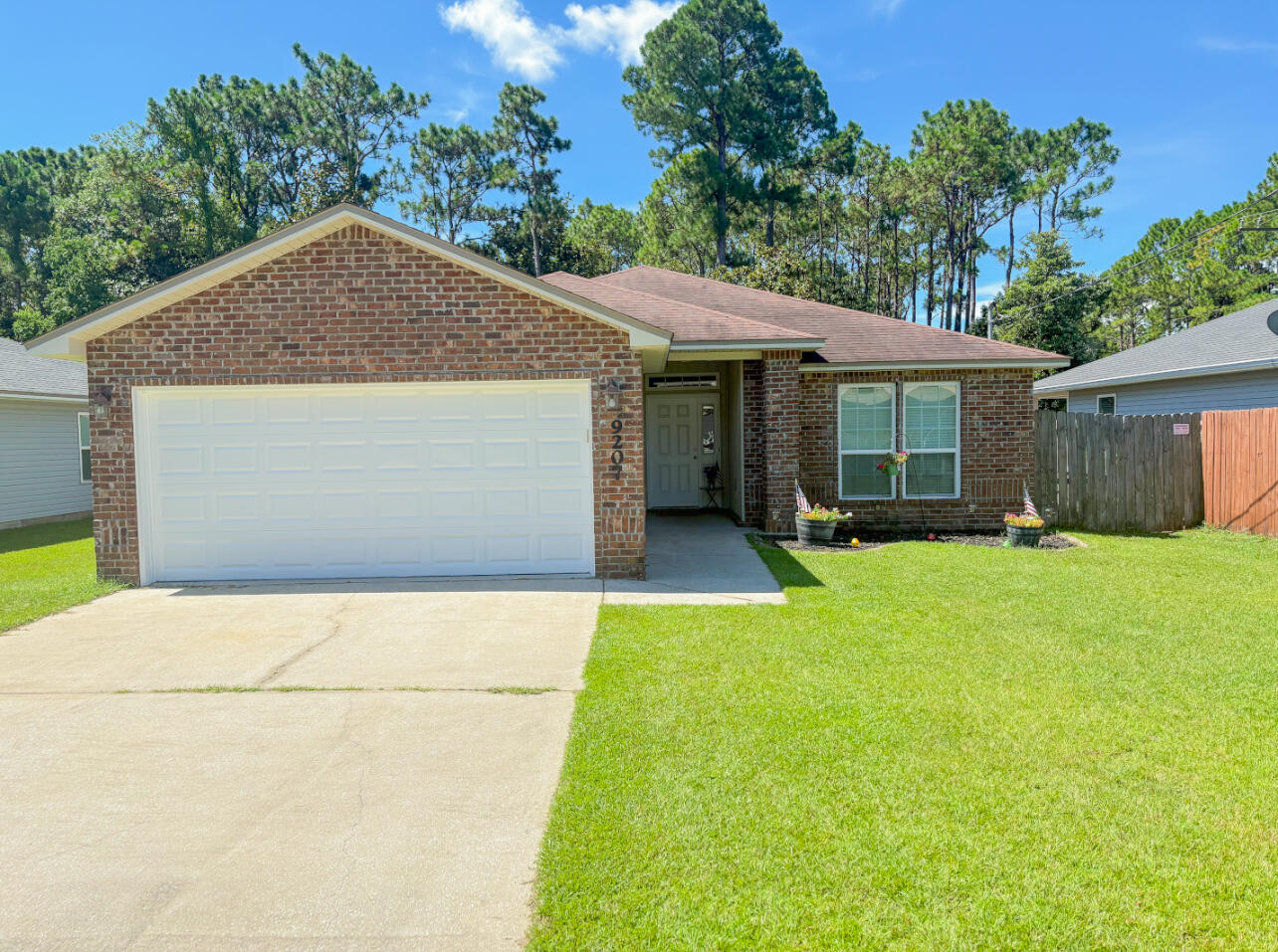 Charming Coastal Living at 9207 Timber Lane | Navarre, FL 32566Welcome home to this delightful 4-bedroom, 2-bath beauty nestled on a quiet dead-end street in one of Navarre's most sought-after neighborhoods. Built in 2014, this lovingly maintained home is full of character and comfort, offering the perfect blend of style, function, and location.Step inside to an airy open-concept layout featuring soaring vaulted ceilings, abundant natural light, and a spacious living area made for gathering with family and friends. The kitchen is the heart of the home--complete with gleaming granite countertops, stainless steel appliances, a large breakfast bar, and plenty of cabinetry for all your culinary needs. The thoughtfully designed split-bedroom floor plan gives everyone their own space, with a generous primary suite that feels like a private retreat boasting a walk-in closet and a bright en-suite bathroom with double vanities.
Outside, the fully fenced backyard offers a peaceful escape ideal for morning coffee, weekend BBQs, or watching kids and pets play freely. You'll love the unbeatable location just minutes from Navarre Beach, local military bases, shopping, dining, and top-rated schools. Sports families will appreciate the quick access to soccer fields, the YMCA, and the Navarre Youth Sports Association.
With its quiet street, coastal charm, and move-in-ready condition, this home truly has it all.
Don't miss your chance to fall in love!