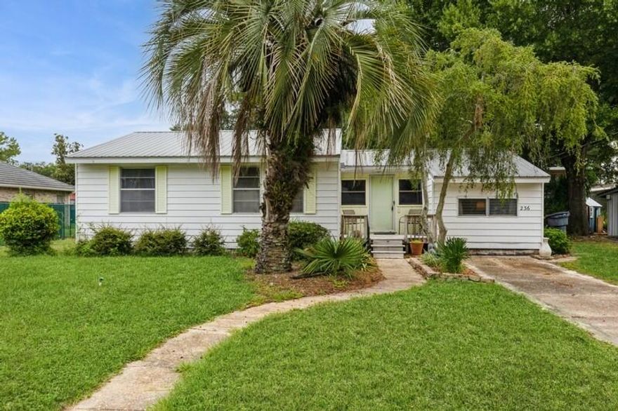 NEW PRICE! Welcome to Old Florida charm with the conveniences of City living! This neighborhood is home to a slower pace & friendly folks! Enjoy coffee on the front porch with great views of Cinco Bayou, Fort Walton Yacht Club & Choctawhatchee Bay! Only one house over from Garnier's Beach City Park, which features a lovely, white, sandy beach, shallow boat ramp-perfect for jet skis, paddleboards, kayaks & small sailboats; playground, restrooms & plenty of room for play! This property has been in this family for decades & used exclusively for family vacations--never rented! Furnishings remain! Metal roof! Gas water heater 2023! Gas stove 2024! Easy drives to beaches, bases, shopping, food & fun!