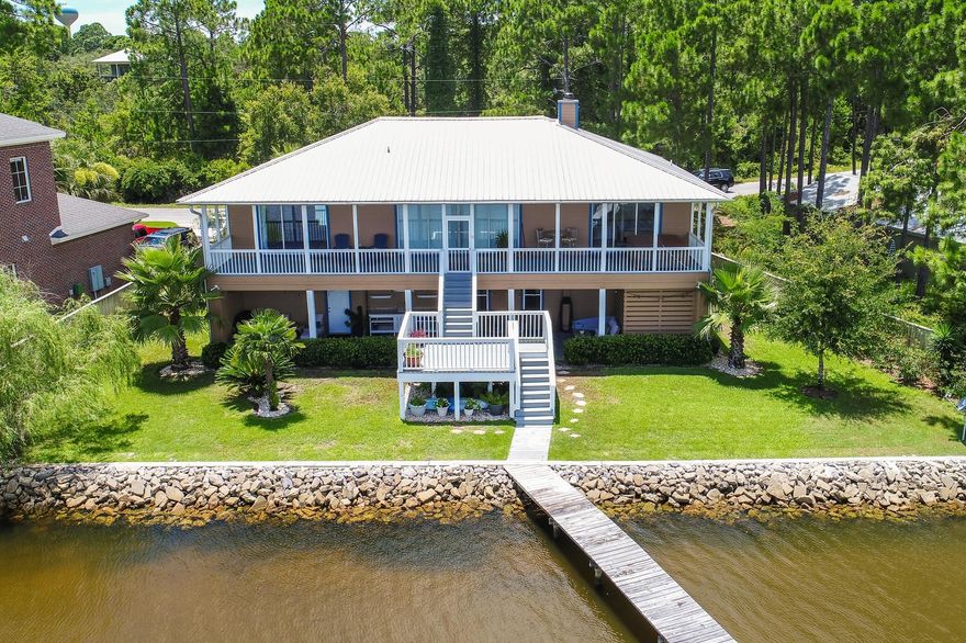 Phenomenal one of a kind Bay front home with nearly $300,000 in custom upgrades! Enjoy the serenity of Choctawhatchee Bay with the private dock and boathouse including a new lift. The home offers incredible outdoor living with an amazing covered patio complete with bistro lighting, custom outdoor shower, sink & grilling area, not to mention the sun deck and expansive balcony with premier views and a hot tub. The lot is a great size totaling 0.35 Acres and is surrounded with tropical landscaping, a paver stone driveway, two separate garages and newly added front porch with beautiful Spanish cedar ceilings, copper lighting and outswing Mahogany door. This home is water tight with $75k added in a new gutter system, french drains and sealant making maintenance easy with the Florida climate.
