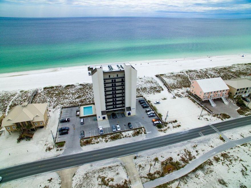 GULF FRONT CONDO on Navarre Beach with panoramic views of the ocean.  This nicely updated END UNIT features 2 bedrooms, 2 full baths, tile floors throughout, white cabinetry and a neutral color scheme. The master bedroom is gulf front as well, offering the most amazing views.  Relax and take in the sunrises and sunsets from the very expansive balcony that can be accessed by either the living area or the master suite.  Are you considering an investment property or second home?  Then this condo would make a great fit.  The unit is well appointed and comes fully furnished, making it turn key ready for anyone looking to rent the unit immediately. Steps away from the Gulf of Mexico, or soak up the sun poolside.  This unit will go quickly so contact your agent today for a private showing!!