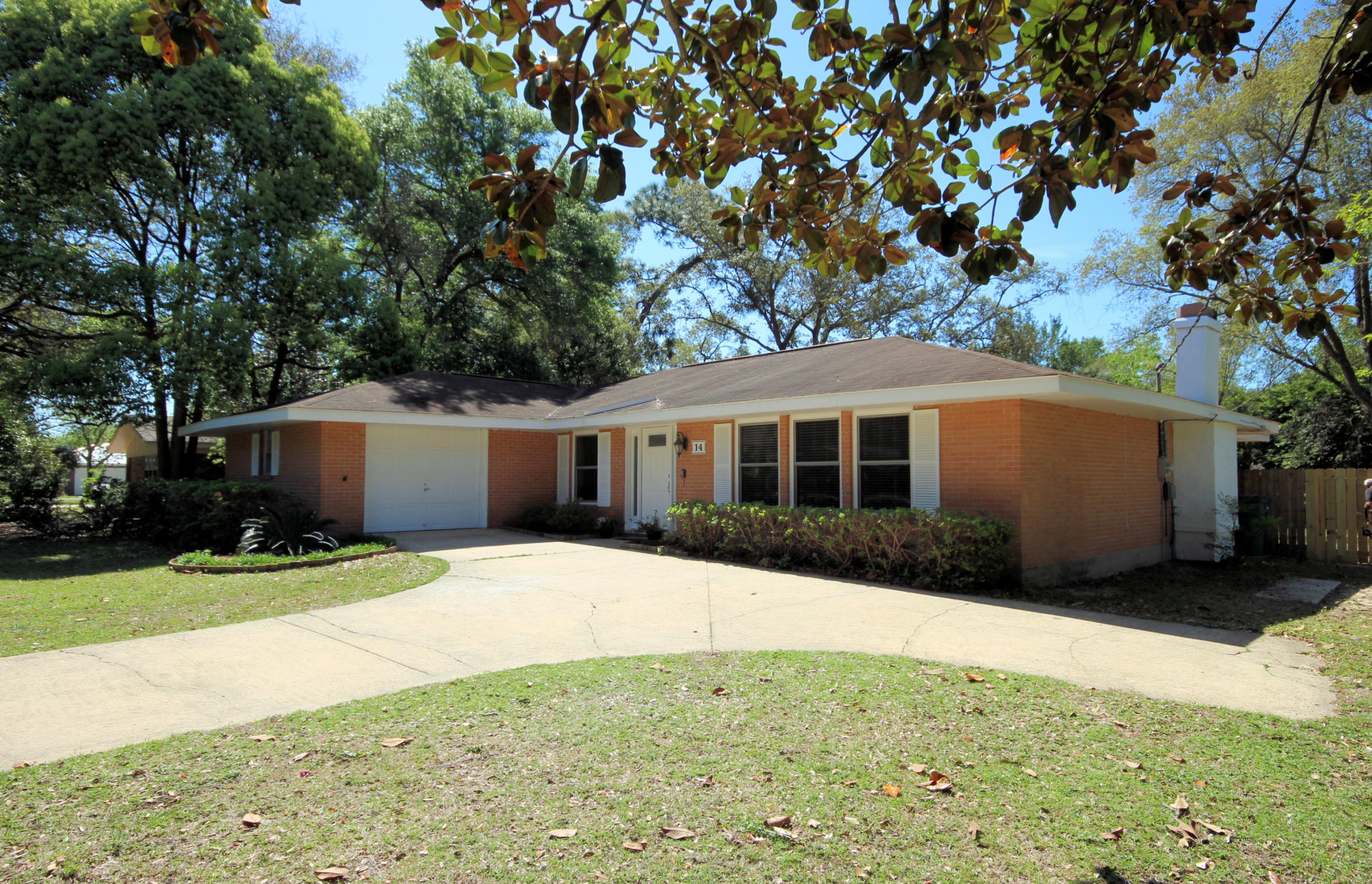 Turnkey and Pristine brick (3) bedroom home in Bayou Poquito. Sellers have added beautiful laminate wood flooring throughout Kitchen, Family and Living/Dining area, and carpet in bedrooms. The Dining/Living area features a wood burning fireplace and built in bookshelves. Fresh paint and a brand new front door flanked by glass panels welcome you. Enjoy cool breezes on the large screened patio (12' X 48') that runs the entire length of the home and accessed from (3) sets of sliding doors in Master bedroom and family room. Privacy fenced shaded back yard with pretty Camellias and handy shed. Enjoy nearby park, playground, and boat launch. Home only minutes from Eglin Air Force Base. Newer A/C unit in this well maintained home. Plenty of storage. Homes in this neighborhood sell quickly!