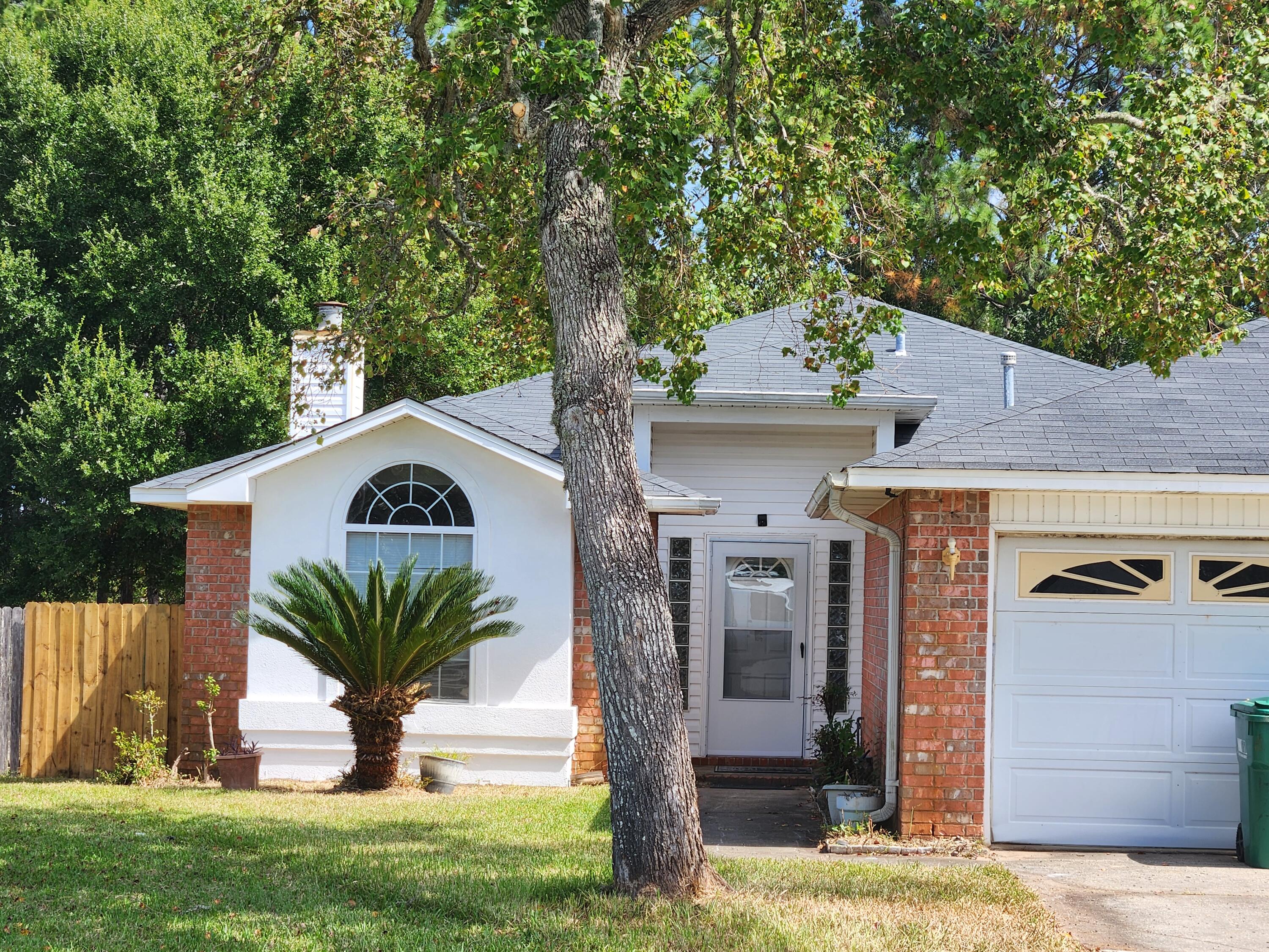 Welcome to this ideally located 1 story home, only 1 mile from Hurlburt Field and only 20 minutes to Eglin AFB.Step inside to a tile entryway and cozy fireplace, with stylish LVP flooring throughout the main living areas. The home features both a dining area and breakfast nook-perfect for casual meals or entertaining. Just off the kitchen with new stainless appliances.Enjoy a split floor plan that offers added privacy, with the fourth bedroom offering flexibility as a home office, gym, or playroom--your choice!Soothing paint tones pair perfectly with the woodgrain-style flooring, creating a warm and inviting atmosphere. Step out to the covered back porch for enjoying morning coffee or evening breezes. The backyard backs up to the base, so you'll love the added privacy.