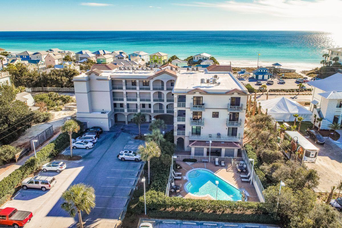 This boutique 13 residential unit condominium property is superbly located across from Ed Walline Park and Gulf Place Shoppes and Restaurants. White sandy beaches, emerald waters, great restaurants, shopping and art galleries are steps away. This lovely, well planned corner condominium has a view of the Gulf of Mexico from the living room and breakfast area. Large balconies overlook the beautiful pool and dolphin fountain. This outstanding residence is appointed with fine finishes such as granite counter surfaces throughout, stainless steel appliances, carefree ceramic tile in all main living areas, custom wood cabinetry and spacious closet space.