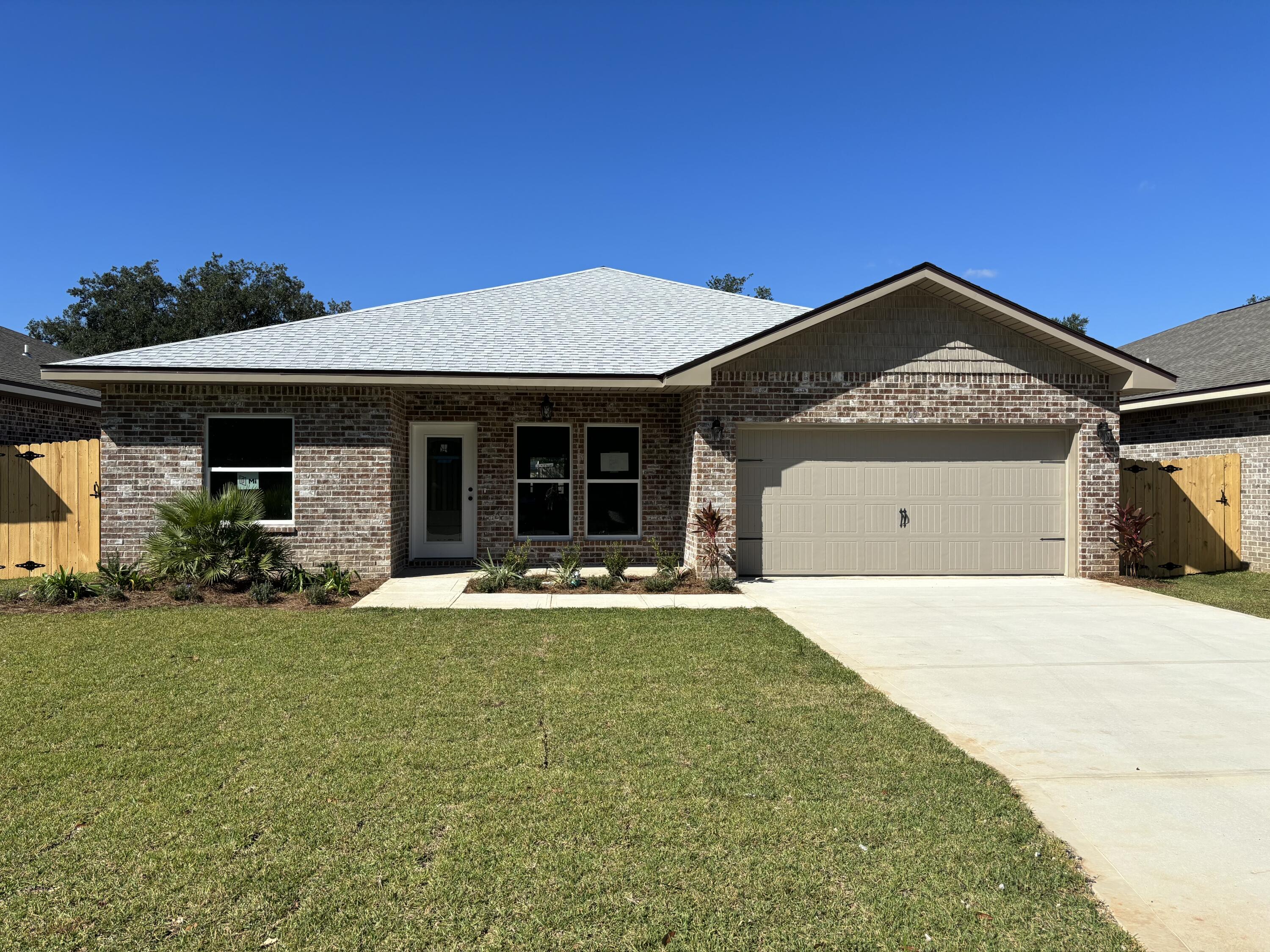 Seller offering to pay up to $15000 in buyers closing costs with use of preferred lender. New construction in the heart of Shalimar. 4BR/3BA, 2CG custom brick homesite has 9 Ft. ceilings w/ impressive crown molding, LVP flooring throughout most of the home, tile in the master bath, and 5 1/4'' baseboard throughout. Kitchen boasts custom painted white cabinetry, granite countertops, a large pantry, and stainless appliances. Master suite is in the right rear of the home, is very roomy, has 2 large walk - in closets, a marble walk - in shower with glass enclosure, a whirlpool garden tub and double vanity. The great room is located at the rear of the kitchen and opens to a covered porch, which is perfect for entertaining. The yard is beautifully landscaped, has a privacy fence, and comes complete w/ a sprinkler system, well and timer. Insurance will be very reasonable, as home is built to today's code. Fabric hurricane protection is included for the owner's piece of mind.