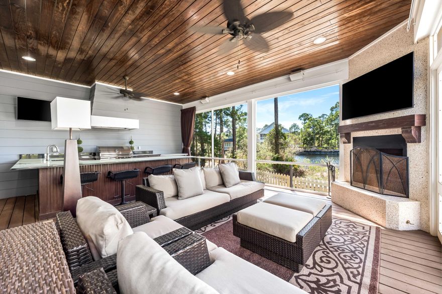 Quintessential coastal living in the prestigious WaterSound West Beach community! This immaculate 4BR/4.5BA lakefront residence boasts unparalleled luxury and comfort, perfect for those seeking a serene lifestyle along Scenic Highway 30A. Beautiful hardwood floors throughout the home, charming millwork including shiplap details and oversized crown molding enhance the coastal aesthetic and create a cozy, inviting atmosphere. The gourmet kitchen features stainless-steel appliances, granite countertops, ample white cabinetry, a center island, large pantry with wine fridge and a custom breakfast nook with banquet seating.Enjoy breathtaking lake views from two generous screened porches, offering the perfect blend of indoor and outdoor living. The first-floor screened porch is a haven of relaxation, featuring a cozy fireplace, a spacious sitting area, outdoor vented grill and a fully equipped bar for effortless entertaining. The second-floor screened porch is your personal sanctuary, complete with a comfortable sitting area and a soothing hot tub to unwind after a long day.
The main level primary bedroom has a stunning tray ceiling with wood beams and is a spacious and peaceful retreat. The luxurious ensuite includes soaking tub and large shower plus a walk-in closet with custom cabinetry ensuring ultimate comfort and privacy. The second floor includes two additional guest bedrooms, each with its own ensuite bath and walk-in closet, providing a private and comfortable space for visitors. Currently configured as a second living area, the fourth bedroom also includes an ensuite bath and breakfast bar with beverage refrigerator, ice maker and sink, offering flexibility to suit your needs. 
The attached 2 car 25 x 22 garage is oversized with 10' ceilings and plenty of storage room plus 10 x 8 hurricane resistant garage doors.  A fenced area on the side of the house is the perfect spot for pets or a private garden. 
Nestled between the Gulf of Mexico and the 2,000-acre protected sanctuary of Deer Lake State Park, WaterSound West Beach offers a rare sense of seclusion behind its gates with thoughtfully placed homes featuring striking, maritime-style architecture. Winding weathered boardwalks stretch through the dunes to the breathtaking shores of South Walton. Community amenities include several parks, a zero-entry swimming pool with grilling area and outdoor fireplace, a coastal dune lake, miles of boardwalks, and deeded beach access.
