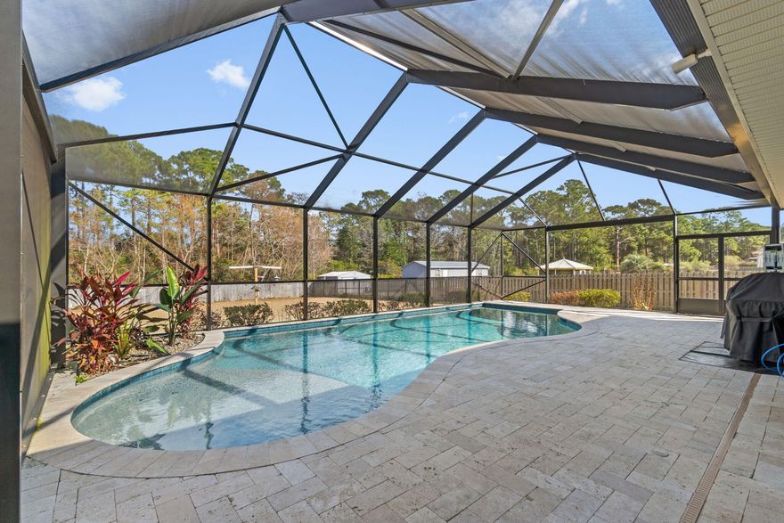 This is the one. The pool home you've been searching for! 4 Bedrooms + a Bonus room with  3.5 Baths on a .9 acre parcel in Whispering  Pines Estates. No HOA! The property boundary extends beyond the fence line providing a privacy barrier of natural forest between you and neighbors. It will never be cut down or built on, unless you want it to. The patio and pool are a dream come true for Florida living. Recently installed in 2023, the 17'x 34' gunite and pebbletech pool is heated and features a sundeck, umbrella holder, bubbler, and  a saltwater system for low chemicals, and soft luxuriously clean water. The pool has a top of the line filtration and pump system with a Paramount In-floor filtration system for extremely low maintenance. It's almost self-cleaning. A Dolphin robot in-pool vacuum along with all pool equipment and accessories will be left for the buyer. 

The patio pavers are natural travertine stone. Timelessly beautiful, low maintenance, slip resistant, and feel soft under your feet. Travertine reflects sunlight so it never gets too hot under your feet, or your pets paws!  

The lanai is fully enclosed with a specialty bug screen. Not even gnats can get through. Drink your morning coffee and listen to the birds sing, or sit under the covered patio during a heavy afternoon rainstorm and replenish your soul. On cool winter evenings you can leave the back doors wide open and enjoy fresh air throughout the home without a single worry. The screen on top of the lanai is a UV screen that protects the water from getting too hot in the summer, and protects people from sunburn and UV sensitivity, while still allowing enough light through for a tan. That means - you can enjoy the pool all day & night, all year long! 

Additional upgrades that combine peace of mind with functionality:

-2023 HVAC, upgraded to 4 ton system with Reme-Halo UV air sterilizer. 
-2023 50 gallon water heater installed. 
-Durable Wood-look tile with well designed tile transitions installed in master bedroom and main living areas.
- Canvas hurricane shutters with mounting hardware included. 
- Expanded mudroom & laundry area. 
- Doors added to bonus room to create a private office space. 
- Hood vent that actually vents outside!! 
- Work benches installed in 3rd bay of garage.
- Hanging tool storage, fishing rod holder, and dog food storage bins installed in garage. 
- White garage refrigerator, installed 2023, is garage-use rated and included, along with white garage cabinets. 
- Fully customizable and automated B-Hyve irrigation system. 
- Built-in theatre surround sound system with Klipsch Atmos speakers installed in living room ceiling and are included. 

For additional peace of mind the home has been fully inspected with no major issues found. The home inspection report will be available upon request for pre-approved buyers. 

Schedule your showing today!  This home is a dream. 






