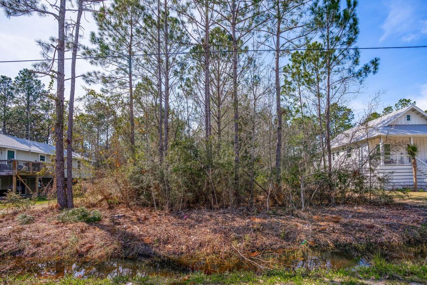 Opportunity in North Santa Rosa Beach.This homesite on N 7th Street offers county water and sewer available at the street -- a major advantage when planning your build. Fewer unknowns. Cleaner path forward. No HOA. Let me say that again -- no HOA. No association fees. No added restrictions beyond Walton County building guidelines. The property is located in Flood Zone AE, which is common in this area. Proper elevation and flood insurance planning will be part of your build strategy -- and that's simply part of building smart along the Emerald Coast. Location is where this lot really shines. You're just minutes from Cessna Landing for easy access to Choctawhatchee Bay -- boating, fishing, paddleboarding, sunset cruising. The Cultural Arts Alliance of Walton County is close by, keeping you connected to classes, art festivals, and community events. And the beaches of South Walton and the 30A corridor are just a short drive away.
North Santa Rosa Beach continues to attract buyers who want proximity to the Gulf and bay access -- without being in the middle of the 30A congestion.
Build now. Hold for the future. Either way, this is a solid piece of Santa Rosa Beach real estate in a growing area.
Buyer to verify lot dimensions, zoning, and building requirements.