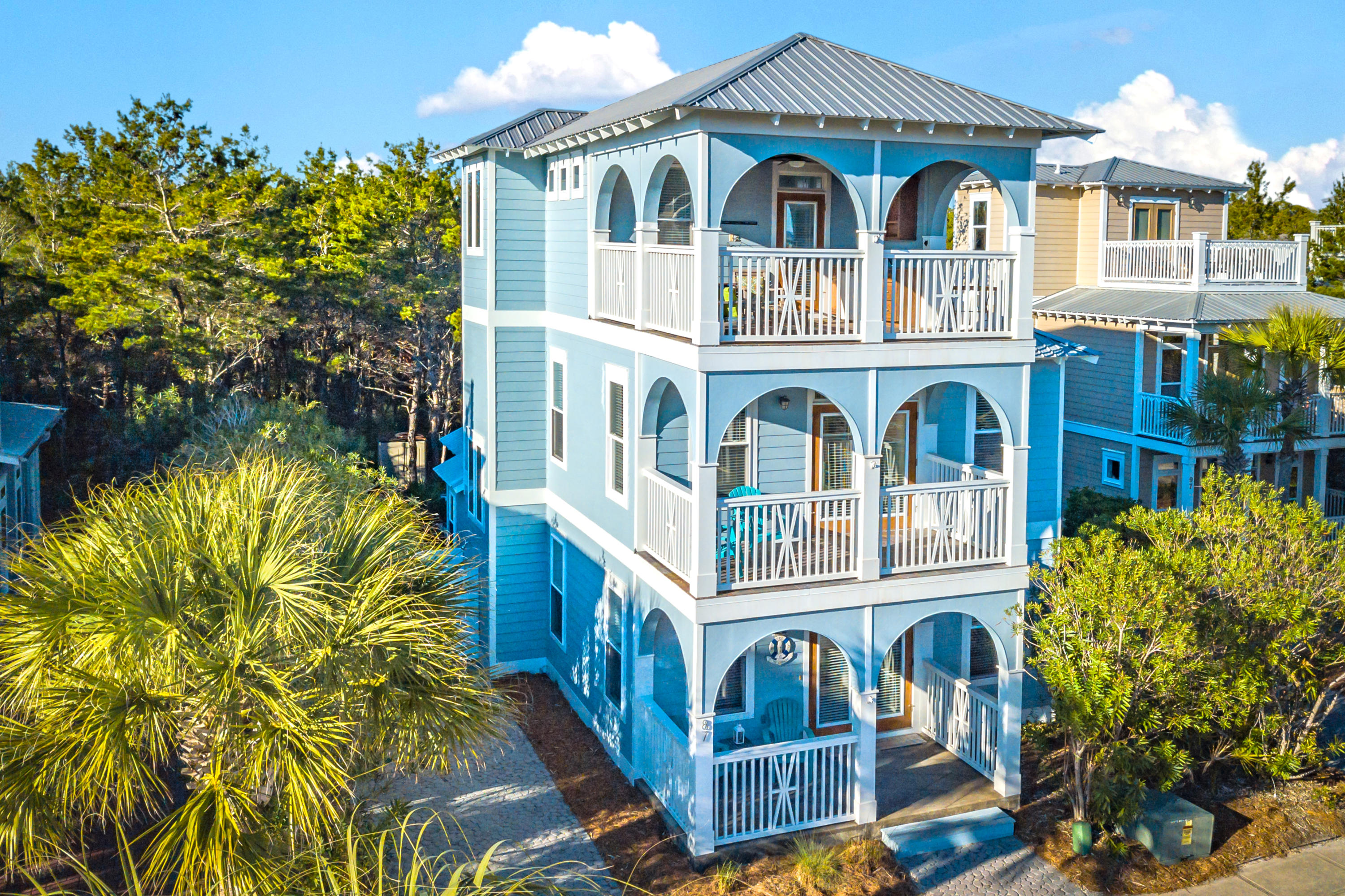 Exquisite rental-ready Seacrest home walking distance to the beach, pool, shopping, restaurants, and Rosemary and Alys Beach. Step onto the charming front porch and in through the front door, and you're met with abundant natural light flowing into the open and inviting living space. The alluring scored concrete floors lead you into a beautifully appointed kitchen with granite countertops and all stainless steel appliances. Out the back of the property is an expansive deck and grilling area. It overlooks a lush wooded green space, offering exceptional privacy, and creating your personal backyard sanctuary, perfect for entertaining guests and enjoying dinner outside on those summer nights.