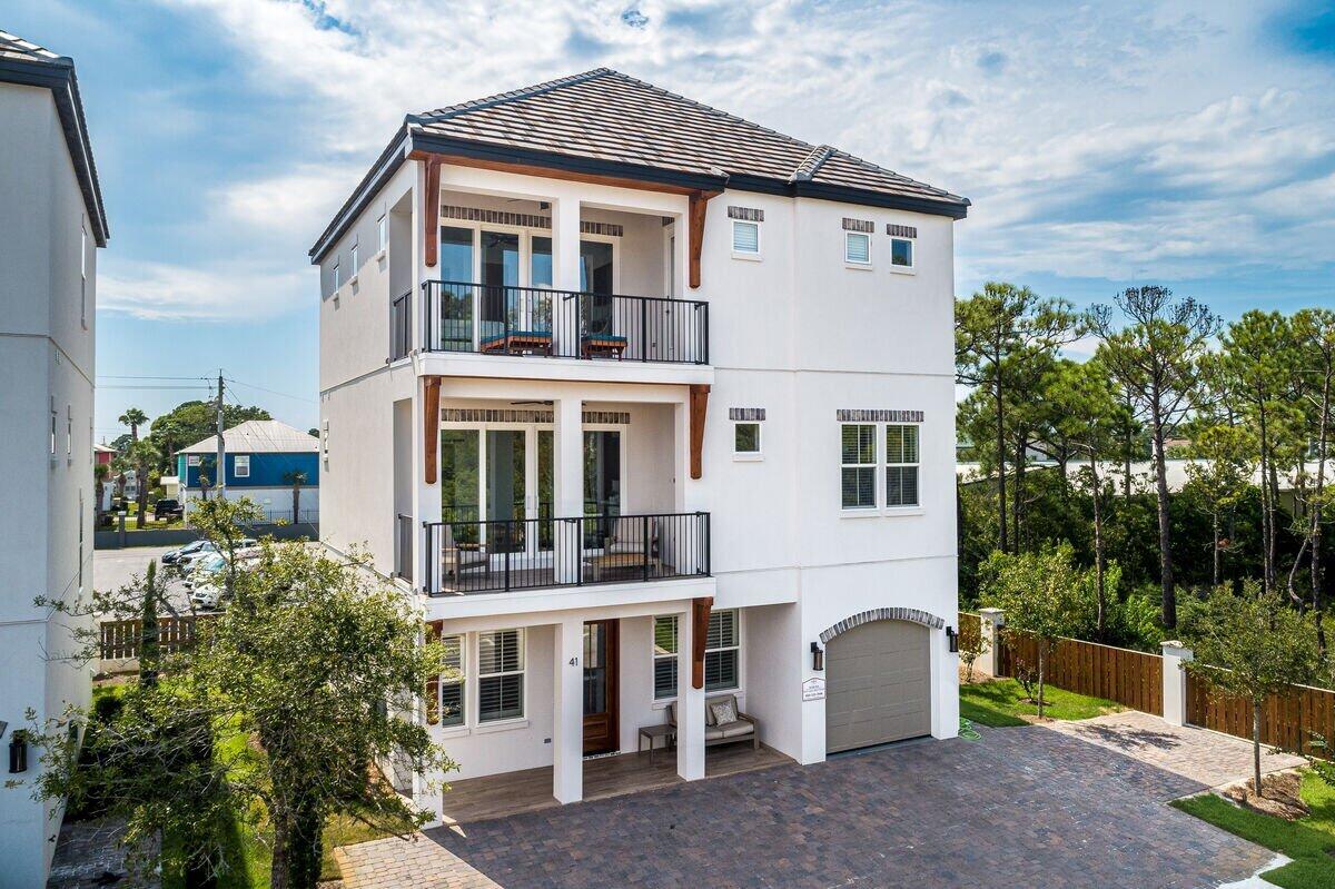 Pristine 2020 built home paired with exceptional finishes and resort style amenities. This beautiful beachside retreat boasts over $180,000 in projected annual income! 41 Mellow Way is prominently positioned just a few tiers back from the Gulf of Mexico and a short walk or golf cart ride to Miramar Beach's largest public beach access. Appointed with top of line appliances, 66'' built in fridge/freezer, quartz countertops, and hardwood floors throughout. Featuring two living rooms, 7 bedrooms, 6 & 1 half bathrooms, and two large balconies, this rental machine was thoughtfully designed to optimize sleeping capacity while giving everyone space to relax.