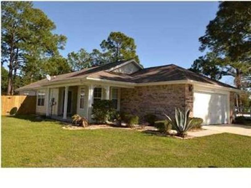 Move In Special! December is FREE!!! This lakefront home sits on a premium lot and could be yours before the end of the month.  You can enjoy the peaceful, serene lifestyle on affordable waterfront property. Yard is fenced except for the lakefront. This is a great rental for the price. To view, come by the Navarre Beach Realty office at 8666 Navarre Parkway in the Winn Dixie Shopping center. Office hours are Mon-Fri 9am-5pm. Keys must be returned by 5pm