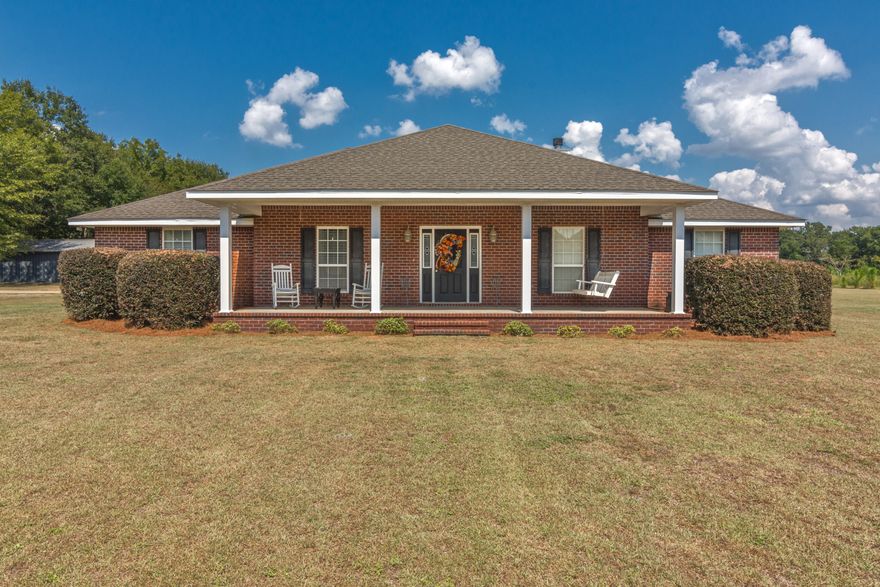 Come on over to the country...this well maintained 4 bd/2 ba home is located on approximately 3 acres (TBD by a survey) near the heart of Baker. Boasting an all brick exterior, this one-owner home features large front and rear porches and a two-car attached carport tucked on the backside. Inside you will find an inviting foyer entrance and semi open floor plan. The spacious living room features a wood-burning fireplace and new laminate flooring (installed within the last year) that also extends to the foyer, formal dining room and hallway. Nice kitchen w/ plenty of cabinet space, breakfast bar and solid surface countertops - adjoining formal dining room and breakfast area on either side. Split floor plan design w/ large master bedroom suite on one side and additional bedrooms/bath on