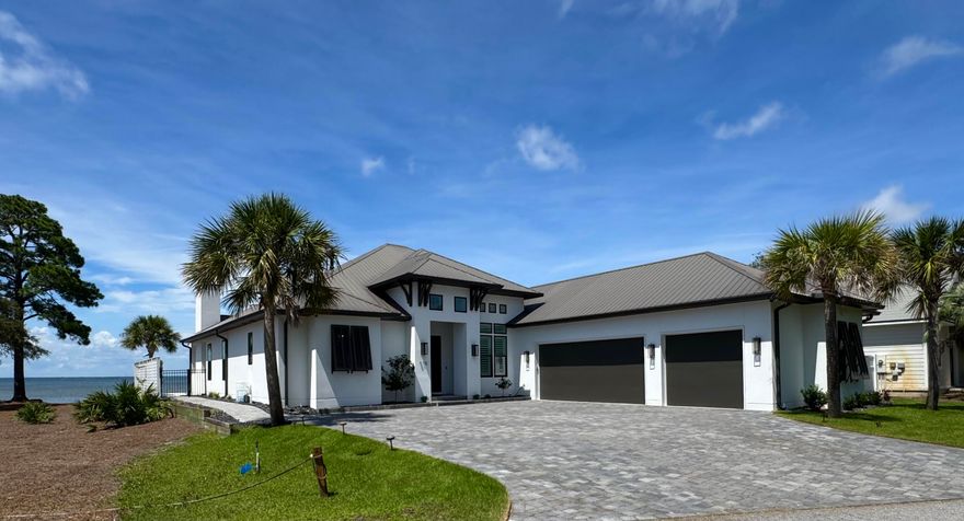 BAYFRONT LUXURY LIVING - PRIVATE DOCK, POOL, AND PANORAMIC VIEWS! Experience the ultimate in upscale coastal living with this custom-built Bayfront masterpiece, thoughtfully designed to capture sweeping water views from nearly every room. This stunning home offers a seamless blend of refined indoor comfort and exceptional outdoor living. The gourmet kitchen is a showstopper, featuring a large island, and quality SS appliances. Outside, paradise awaits. Enjoy a private boat dock with lift, jet ski lift, and swim platform - ideal for fishing, dolphin watching, or sunset cruises from your backyard. The covered patio, outdoor fireplace & summer kitchen overlooks a sparkling private pool & tranquil water fountain! Oversized 3-car garage, and amazing location!  Waterfront living at it's finest!