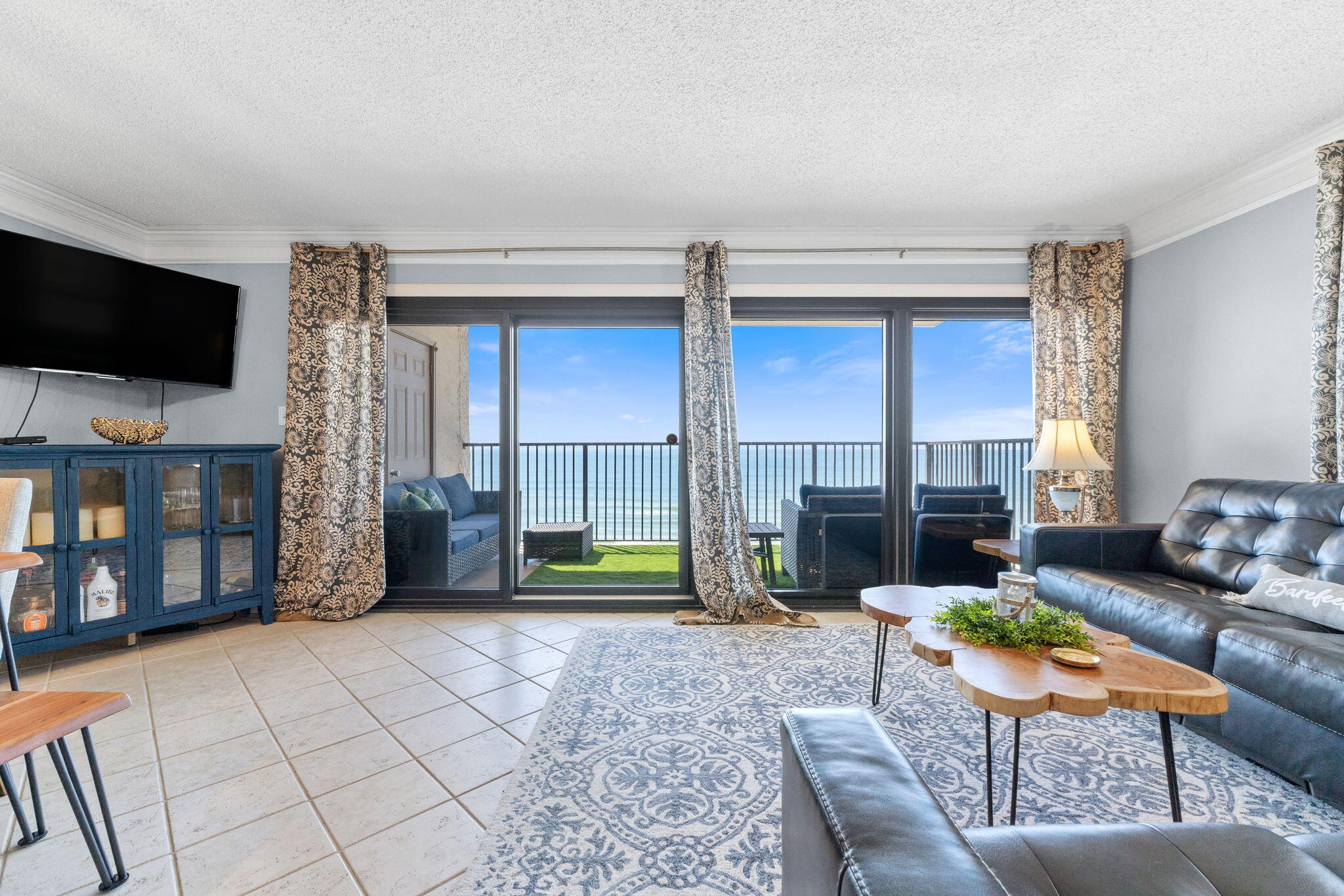 Step into paradise with this stunning 3-bedroom, 2-bath corner unit at Ocean Breeze East, where the Gulf is your backyard. With no buildings to the west, you'll enjoy unobstructed, panoramic views of sugar-white sand and emerald waters from your private beachfront balcony. Every bedroom in this unit offers a glimpse of the ocean, making this a rare find!Inside, this turnkey retreat is freshly painted and features brand-new furniture (included!), sleek backsplash, and stainless steel appliances in a bright, open-concept kitchen. The primary suite is a true escape with double closets, an en-suite bath, and a private north-facing balcony--the perfect spot to unwind.Ocean Breeze East is a low-density complex offering a Gulf-front pool, private boardwalk to the beach, and an outdoor shower. Plus, you're minutes from the Gulf Islands National Seashore, world-class golf, fishing, dining, and the iconic Flora-Bama. With no rental restrictions, this unit is an exceptional investment opportunity or your very own beachfront getaway!
