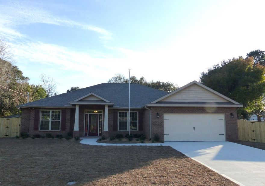 A beautiful custom home with many wonderful personal touches throughout. Features such as Granite Kitchen Counter-tops, Designer Cream Painted Cabinetry with soft-close drawers in the Kitchen, Wood-look Porcelain Tile throughout the main areas, Tumbled stone back splash in the kitchen, Automatic irrigation system with well, GE Stainless Steel appliances, Tray ceilings in the Living Room and Master Bedroom with Crown molding and LED Lighting, Covered Lanai with Ceiling Fan, Finished and trimmed garage with quiet belt driven garage door opener, Hurricane protection with exterior hardware preinstalled for all windows and doors, Spray Foam Attic Insulation, Cultured Marble Garden Tub and Walk-in Shower in the Master Bath with a Custom Shower System including a rain-head shower as well as a