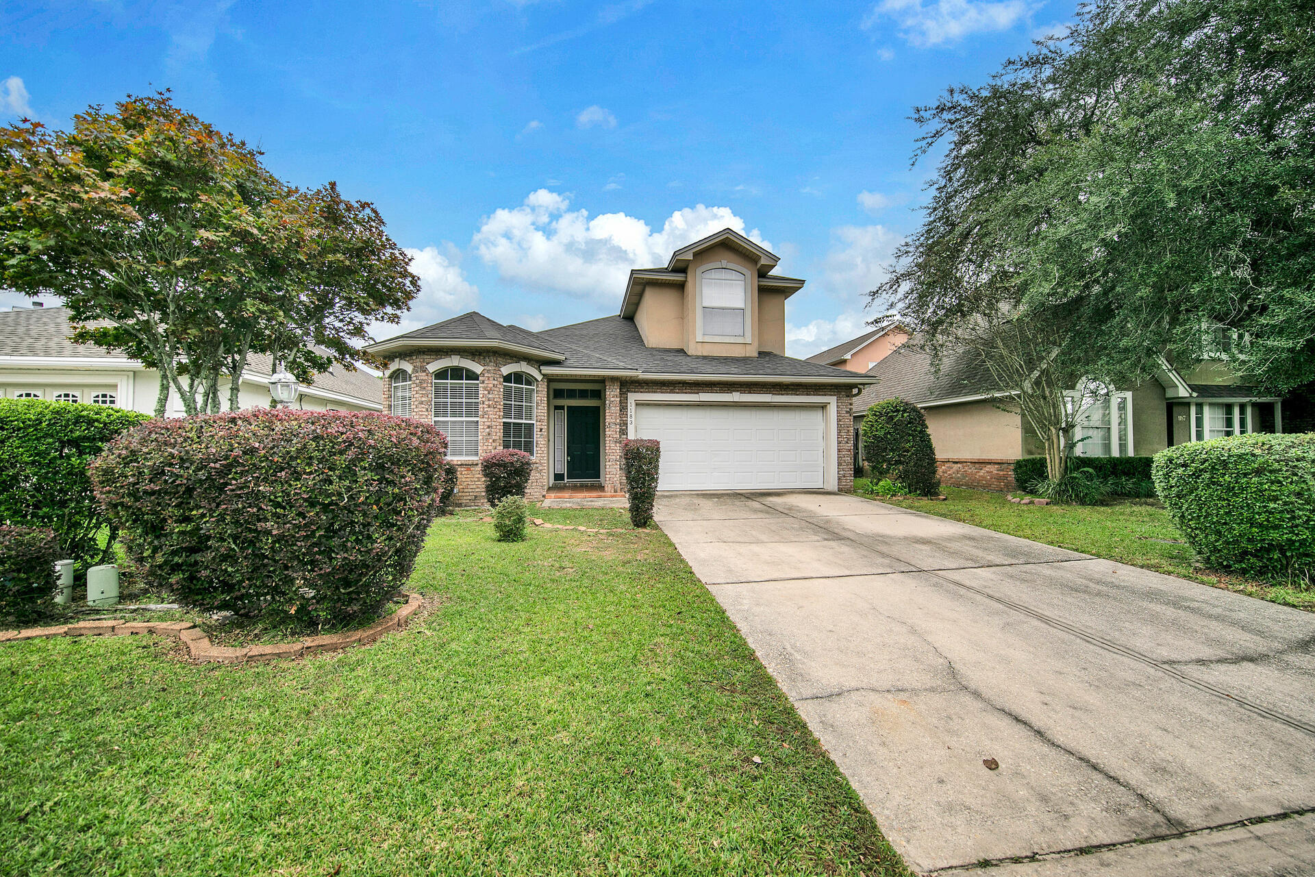 Welcome to 1183 Cathridge Trace! This 4-bedroom, 2.5-bathroom home was built in 1999 and offers 1,912 sq ft of living space in the sought after neighborhood of North Ridge Creek. The home features a two-car garage, split floor plan, roof installed in 2020, and fenced-in backyard with a covered lanai. Entering through the foyer, you'll notice the 11-ft ceilings and beautiful plank flooring throughout the first floor. You will be welcomed by the modern kitchen featuring a breakfast nook, gray shaker-style cabinets, and stainless steel appliances. Flowing into the combined dining/living space, there is plenty of space to entertain and relax by the fireplace or enjoy the outdoors through the triple sliding door to the backyard. The primary bedroom offers an en-suite bathroom that includes... ...a walk-in closet, dual vanities, and separate shower/tub. Three additional bedrooms share a full bathroom on the second floor. Located near Eglin AFB, the FWB Center, and major roadways, you won't want to miss this one. Call for a showing today! 
