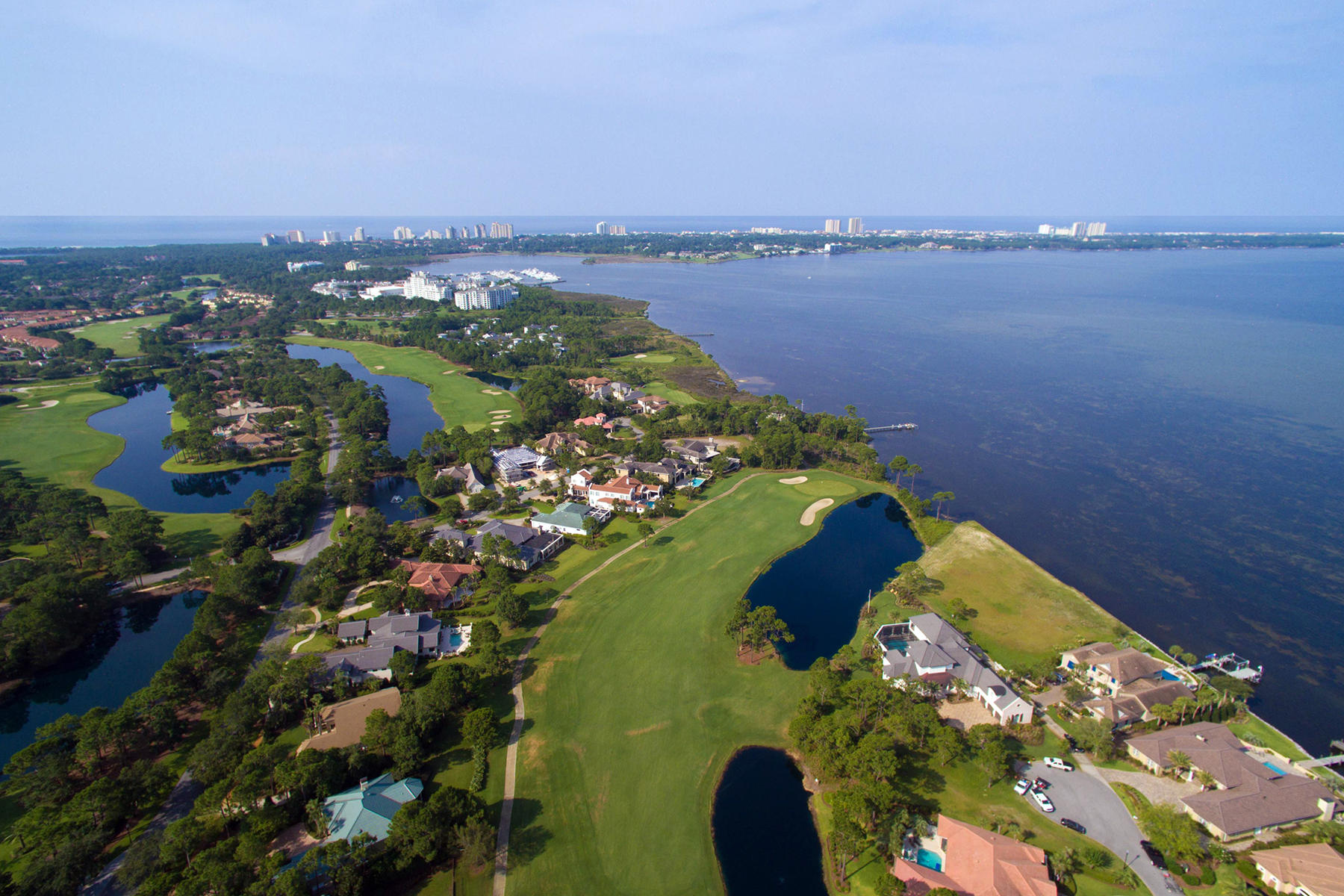 A truly unique lot within the gates of Burnt Pine on the resort of Sandestin. This lot offers not only 180 feet of bay frontage but offers golf and lake views as well. This is one of the few remaining bay front lots in Sandestin and offers the opportunity to build an estate size home with incredible views all within a short distance to all Sandestin has to offer - A 2,400 acre resort with 4 golf courses, 15 championship tennis courts, water sports, marina, fitness center, spa, biking and walking trails along with shopping ,fine dining, and movie theaters located in Grand Blvd at Sandestin. And, of course, the most beautiful sugar white beaches you have ever seen.