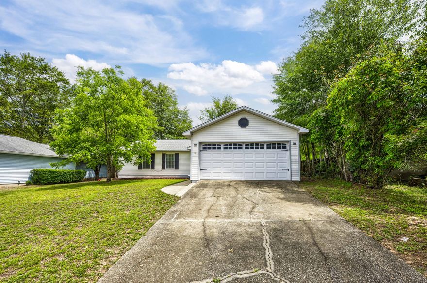 Are you ready for the perfect starter home in South Crestview? This stunning 3-bedroom, 2-bathroom gem offers the perfect blend of modern comfort and cozy charm. Kitchen is pleasantly updated with granite countertops, neutral tile backsplash, and stainless steel appliances. The living room features cathedral ceilings, tiled fireplace surround, and laminate flooring. Both bathrooms have upgraded vanities with beautiful cabinetry and granite countertops! Backyard has a privacy fence and fire pit. Situated at the first stop light in Crestview, makes for a convenient commute to Duke Air Field, 7th SFG, Camp Rudder, and Eglin AFB! This house is a can't miss! Additionally, the gas water heater was replaced 2017, HVAC in 2019, and roof in 2016. Makes for easy maintenance!