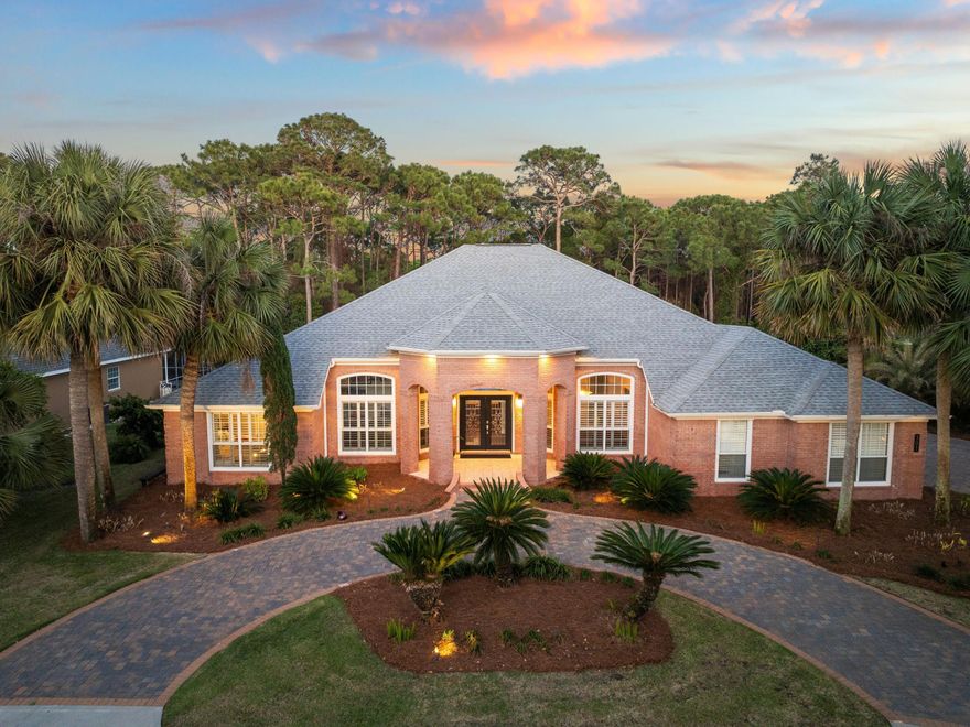 This elegant, single-level brick home offers an unparalleled combination of classic design and modern updates. Situated in the prestigious Kelly Plantation neighborhood, this residence boasts nearly half an acre of private, lush grounds, backing up to a tranquil natural preserve. Every corner of the home reflects sophistication, from the soaring 12-ft ceilings to the designer Chihuly-style lighting and luxury vinyl plank flooring.

The chef-inspired kitchen is a true highlight, featuring all-new cabinetry and hardware, granite countertops, a glass tile backsplash and a spacious island, perfect for entertaining. Flowing into the sunlit family room with a gas fireplace, the home offers seamless spaces for both relaxation and hosting. The primary suite provides a private retreat with a two-sided walk-in closet,  a spa-like ensuite bath and access to the patio and pool area. 

The two additional bedrooms are joined with a spacious Jack and Jill bathroom with a double sink vanity and separate bath/shower area for added privacy. 

Additionally, the property has seen over $250,000 in thoughtful updates, including refreshed bathrooms and kitchen, luxury flooring,  new A/C units, fresh exterior paint and extensive landscaping with lighting features. The three-car garage, screened saltwater pool, and spa make this home perfect for both family living and entertaining.

Residents will enjoy access to Kelly Plantation's world-class amenities, including golf, tennis and pickleball courts, walking trails,  fitness center and more, with convenient proximity to the beach, dining, and shopping.

This meticulously maintained home offers an exceptional opportunity for discerning buyers seeking both luxury and privacy