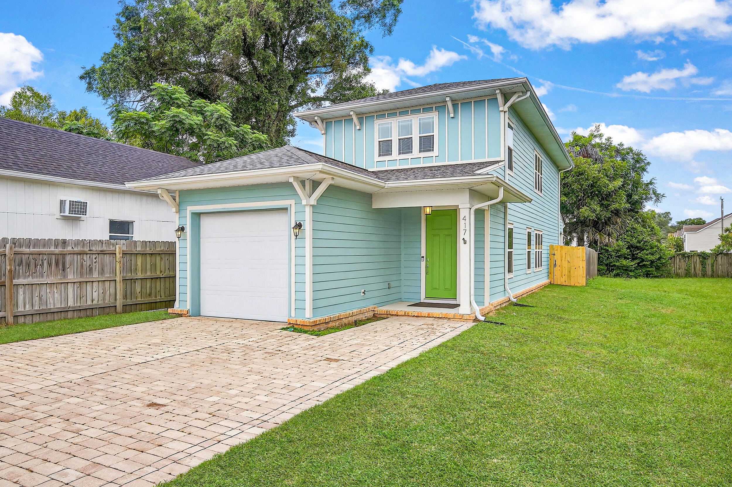 Centrally located in the historic Belmont-DeVilliers area, this beautiful home is in the heart of downtown! Just blocks from Palafox Street's popular farmers markets, dog-friendly bars, & top-rated restaurants, a block from Henry Wyer park, and only one mile from Blue Wahoos Stadium! Built in 2018 and lovingly maintained by its original owner, this property is packed with great features. Inside, you'll find prairie-style windows, 9-foot ceilings, cordless cellular blinds, a 1 car garage, engineered hardwood flooring, and a neutral paint palette throughout. With three bedrooms and three full bathrooms, including two spacious primary suites upstairs, the layout is ideal for families, guests, or roommates. The main living area boasts an open-concept floor plan and the kitchen features soft- close white cabinetry, stone countertops, stainless steel appliances, a gas range, breakfast bar, and a pantry. Each bedroom includes a walk-in closet, ceiling fan, and blackout cordless blinds. The main-level bedroom has direct access to a full bathroom just off the kitchen - an ideal setup for guests. Upstairs, you'll find a spacious laundry room and the two additional bedrooms, each with en suite bathrooms. The primary suite is oversized and includes two walk-in closets, double vanities with stone countertops, and a floor to ceiling tiled walk-in shower with a rain head fixture. The third bedroom, located across the hall, boasts abundant natural light and a private bath with a tiled tub/shower combo and stone-topped vanity. Out back, enjoy a private retreat with a fully fenced yard and a covered porch with ceiling fan, allowing you to relax in the Florida summers. An outdoor shed provides extra storage, and the one-car garage is fully equipped with epoxy floors, a workbench, built-in cabinetry, overhead storage, a workshop wall system, and a generator transfer switch! This downtown gem is move-in ready and offers easy access to all Pensacola has to offer!