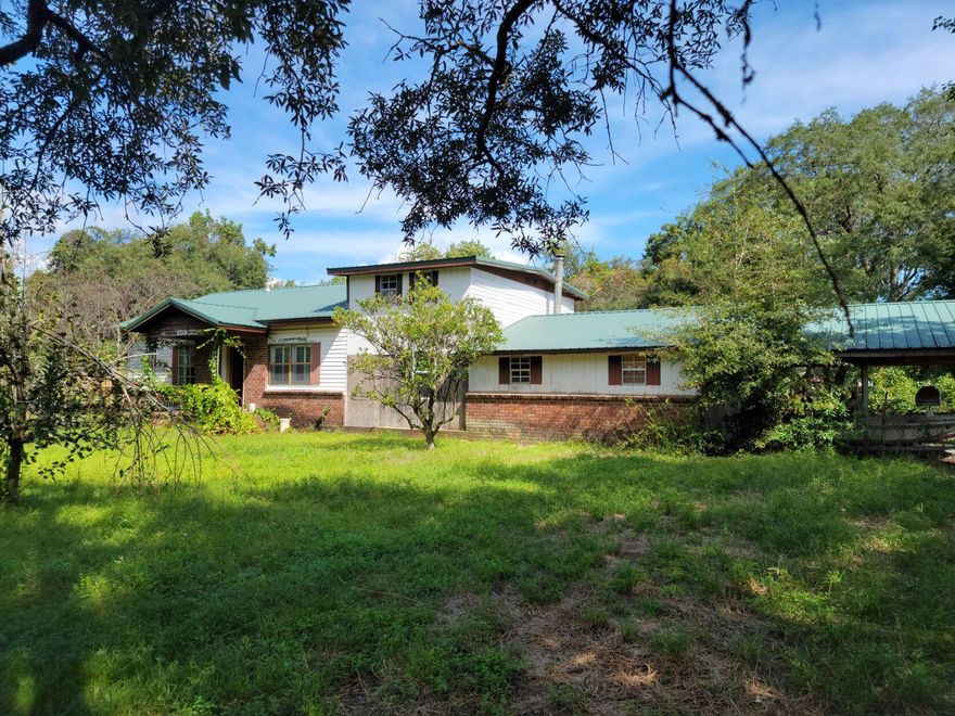 Looking for that Florida Diamond in the rough?! Make sure to put this one on your list! This above grade steel roofed 4 bedroom 2 bathroom contemporary 2,313sqft home is comfortably nestled in Villa Tasso in Niceville by the Gulf of Mexico right off of Hwy 20 and County Line Road. Centrally located just minutes away from the Mid-Bay bridge which will bring you to World Class shopping and fine dining. Do not miss the opportunity to own a piece of the Emerald Coast with this beautiful 1/2 acre (on 3 lots) established Orchard with various citrus and fruiting trees. Zoned rural village allowing for chickens, horses etc....