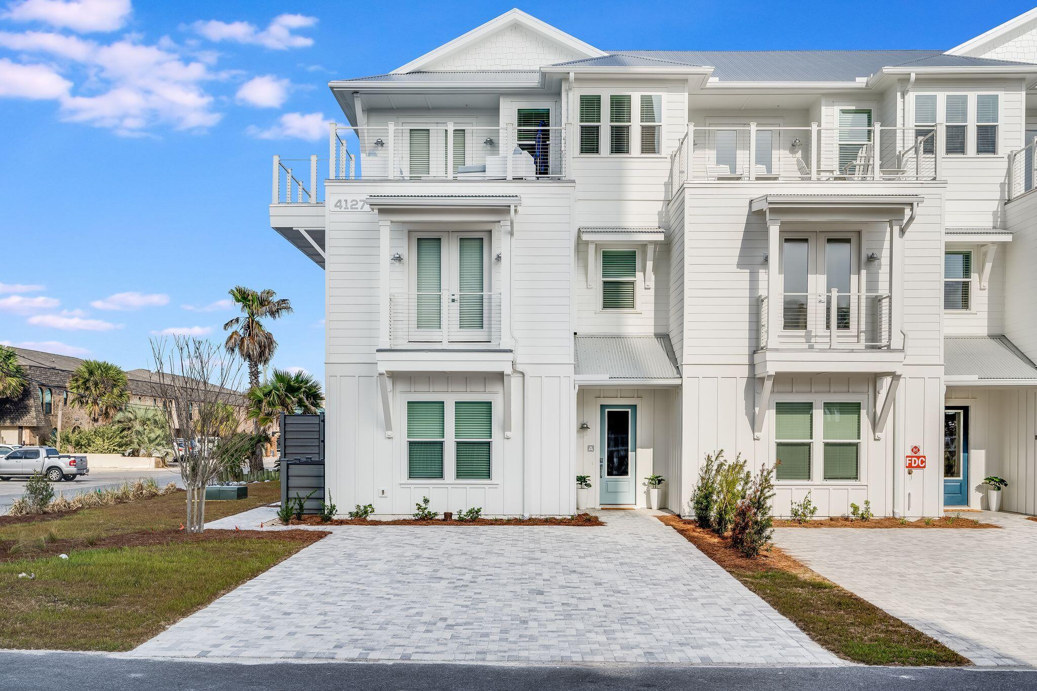 BRAND NEW furnished townhome with elevator! Located directly by beach access and VIEWS of Gulf from third level deck. Centrally located to restaurants and entertainment on the East end of Panama City Beach, this home would make an excellent vacation rental or second home. Professionally designed with a coastal feel, finishes include shiplap walls, white cabinetry throughout, sparkling white quartz counters, and honey oak luxury vinyl plank. Endless features include a private pool with pavered patio, outdoor shower, large open main living area, game room with rooftop deck, wet bar with wine fridge on third level, and spacious bunk room. This home also includes an elevator for easy access to all levels. Furnishings included. HOA fee is estimate and subject to change.