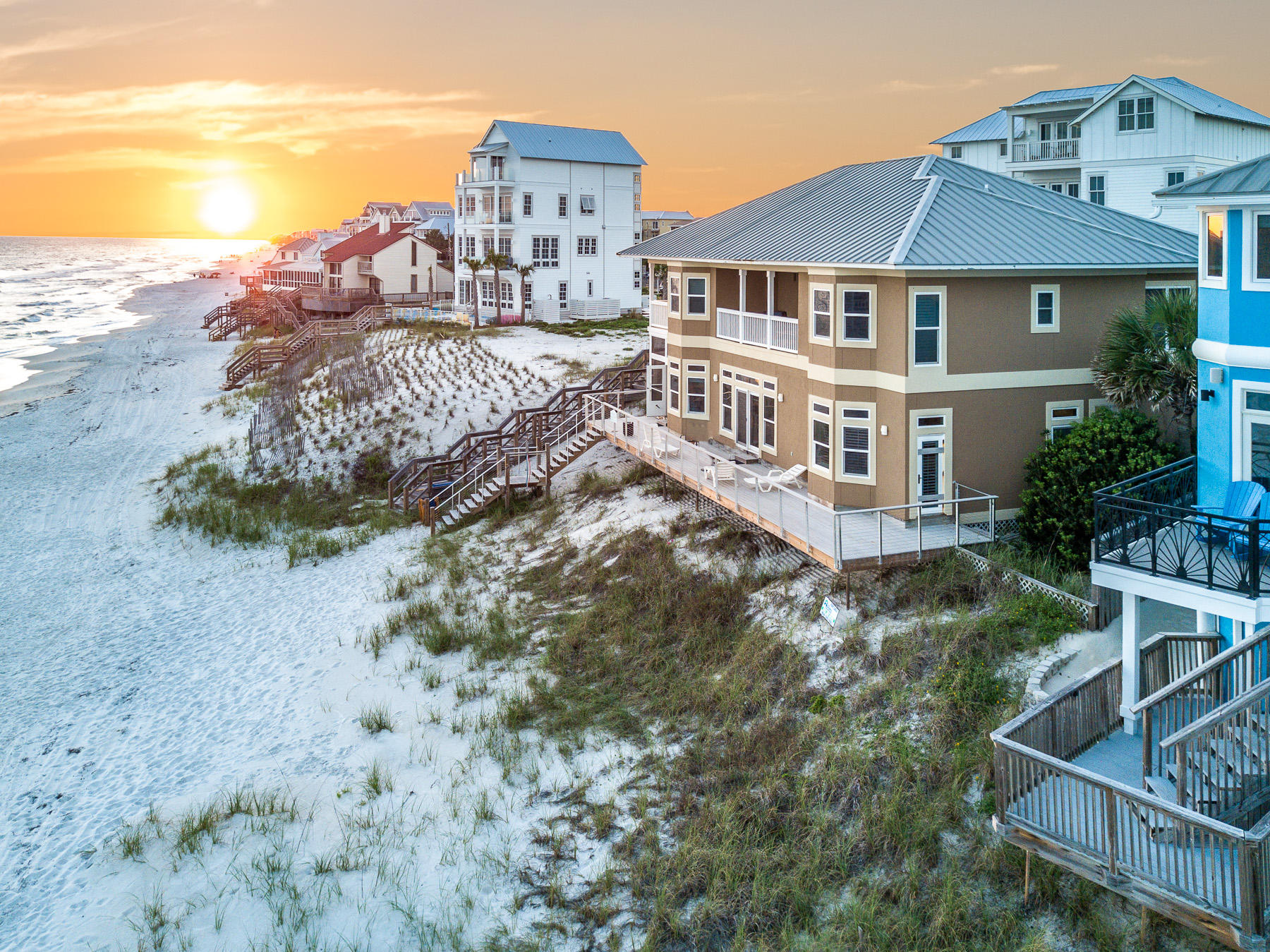 256 S. Wall St. of Inlet Beach, also known as 'Bull & Bear', is a prime opportunity for a rental investment on the Gulf of Mexico. This Gulf front home boasts 89 FT of prime waterfront beach, 5 beds, 4.5 baths, expansive wraparound decks, and 3900 sq. ft. throughout, making it a well-rounded option for both personal home use, or as a key investment property. Walking through the home, you will find that ample comfort is available for you and your guests, as the home offers spacious bedrooms, large living spaces flooded with natural light, and a detached carriage made complete with its own living area, kitchenette, and full bath.