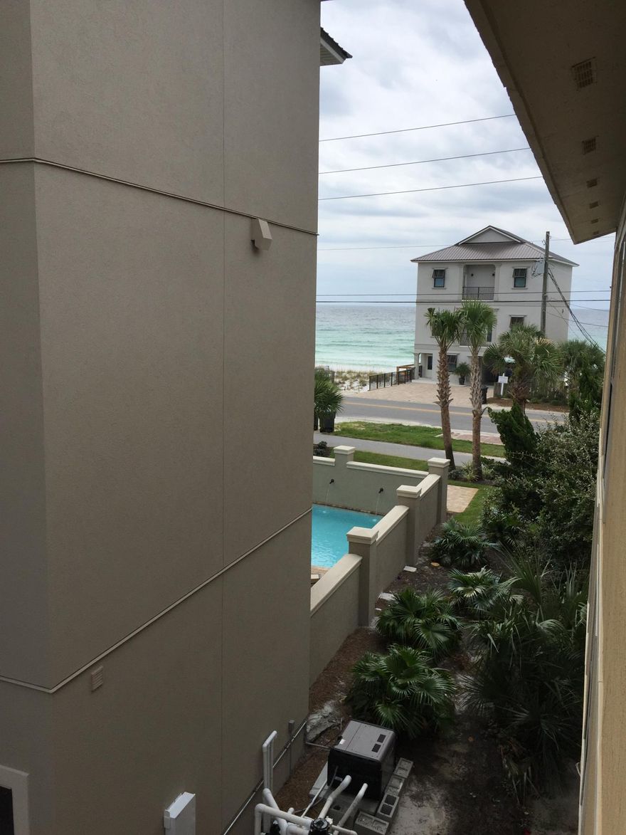 Totally upgraded, furnished unit with appliances that are in great shape-very little use, including a new stackable W&D inside the unit. Owner was builder that has built in Destiny East, Sandestin and Watersound Beach and has added his classic touches to this low priced unit. Bead board and boxed beams on the ceilings are only a few of the upgrades to this unit. Balcony has views of the gulf ( gulf glimpses )and a distant far reaching view of a lake and the golf course at Seascape. A sliding barn door type of wall has been added in the living room that is movable to open up the space from the living area and bedroom making for a more spacious feeling inside the unit. You will have to see to believe the quality of this 'close to the beach' home.