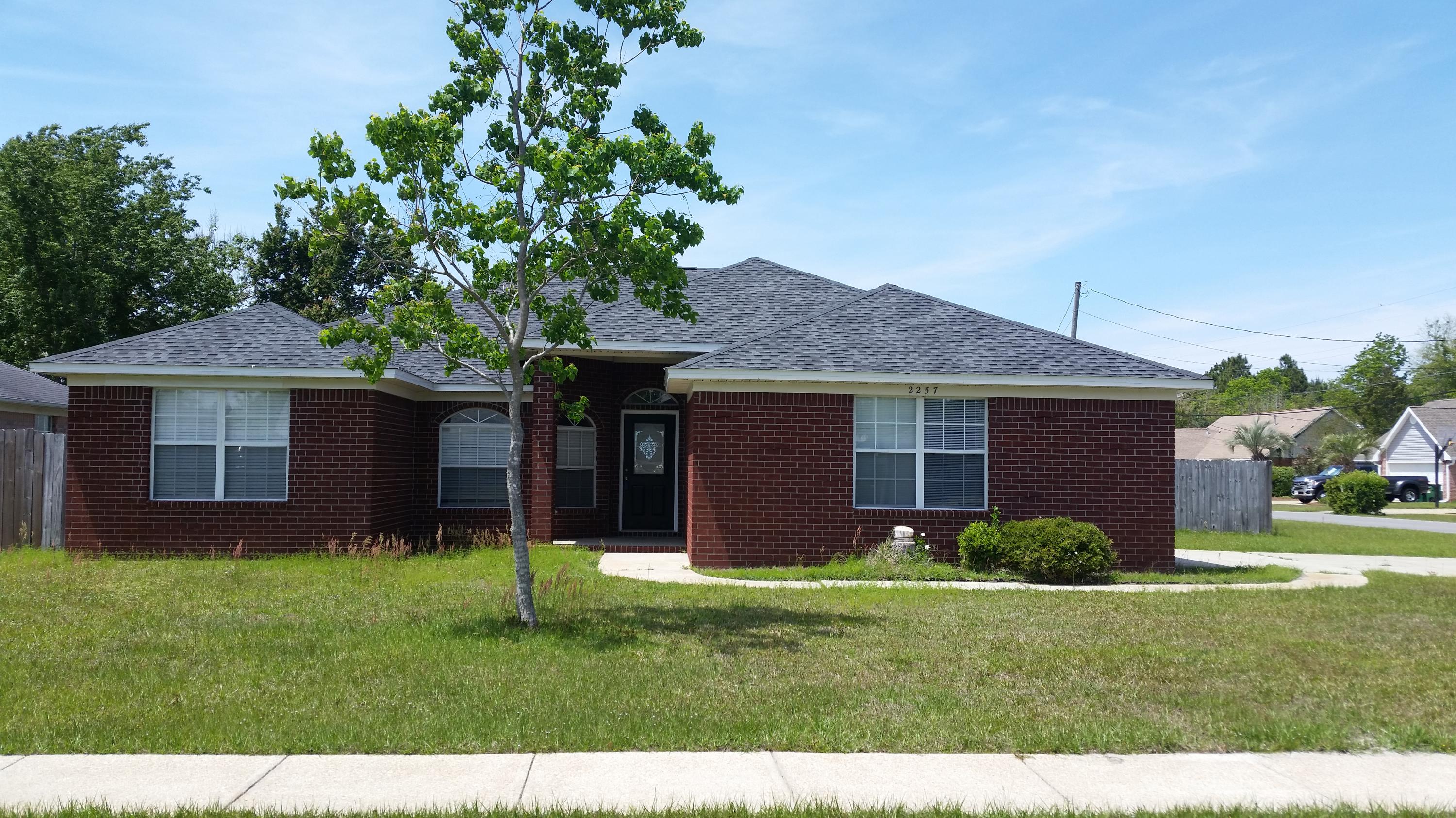 Beautiful All Brick Home in Fox Den. Convenient to Hurlburt Field and Navarre Beach, Navarre Pier and Super WalMart! This House Lives Large with Two Living Areas and a Formal Dining Room. What a really nice layout! Brand New Wood Laminate Flooring throughout Main Living Areas Looks Absolutely Gorgeous. Kitchen with Breakfast Bar open to the Family Room. Beautiful Fireplace. Split Bedroom plan. Large Master Suite with Separate Shower and Garden Tub. Side Entry Garage. Inside Laundry. Sliding Doors lead to the Big Backyard with a nice Patio for Grilling and a Fire Pit for Roasting Marshmallows. This neighborhood even has Sidewalks! What a Wonderful Place to Call Home! See it Today. Buyer to verify all measurements.