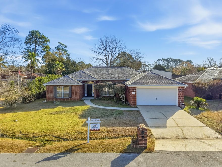 Welcome to this welcoming four-bedroom, two-bath brick home in the heart of Niceville. From the moment you arrive, you're greeted by an inviting entryway accented with glass sidelights on either side of the front door, setting a warm and refined tone.Inside, tall ceilings and a spacious, flowing layout create an open and airy feel. A dedicated formal dining room offers the perfect setting for gatherings and holiday meals, while the cozy gas fireplace anchors the main living area. The home features a blend of tile, carpet, and hardwood flooring, providing both comfort and durability throughout. The primary suite includes a large walk-in closet, a relaxing garden tub, and plenty of room to unwind after a long day. Step outside to a fully fenced-in backyard, ideal for pets, play, and outdoor entertaining. This single-story home offers the ease of one-level living with the timeless appeal of brick constructionconveniently located near Niceville's top schools, parks, and local amenities.