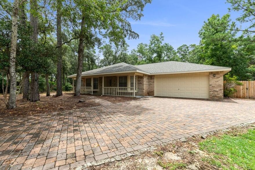 This beautiful 3 Bedroom/2 Bath, Gary Miller built home is located in the highly desired Woodlands Subdivision of Bluewater Bay.  Located on a Cul-De-Sac, incredible .52 acre fenced lot has tons of privacy, mature trees and plenty of room for a pool.   Updated kitchen with custom cabinets, Corian Countertops and tile flooring. Large master suite with walk in closet, large additional bedrooms, formal dining room and a large Screened-In Deck with Trex Flooring.  Roof was installed in May 2021 (warranty transfers). Termite Bond, New 50 Gallon Water Heater and Custom Hurricane Shutters and a Newly Paved Driveway.  This wonderful home is located close to the BEST Schools in the County, shopping and Destin Beaches. Note: Washer and Dryer Convey.  Home is back on the market at no fault of seller.