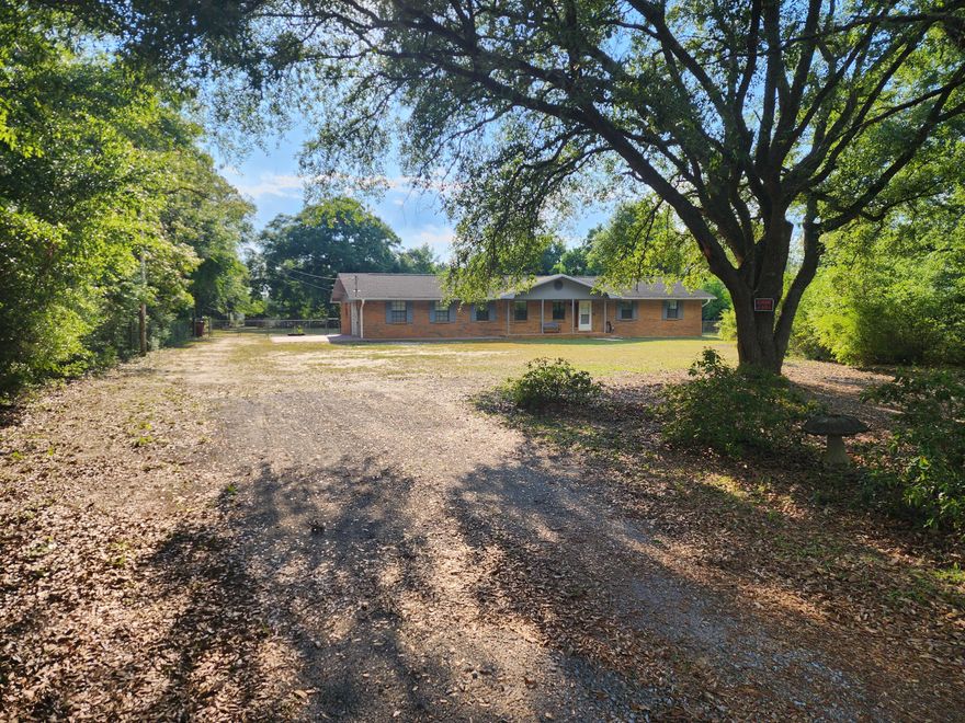 Stop the car and look no farther. If you are looking for a home that is Conveniently Country this home is the one for you. Your new home is located about 10 mins from the developing North end of Crestview, and easy base/beach access as well going South on HWY 285. This wonderful home features tons of space both inside and out giving its new owners plenty of options. Inside you are greeted with an open living concept, 3 bed 2.5 bath, a enclosed Florida room, office space/flex room off the kitchen, laminate or tile floors throughout, granite counter tops, and a nice walk in shower to name a few. Outside is sure to impress as well with your large level 1+/- acre lot, large pavered patio for entertaining, and numerous fruit bearing trees/bushes/vines to name a few.