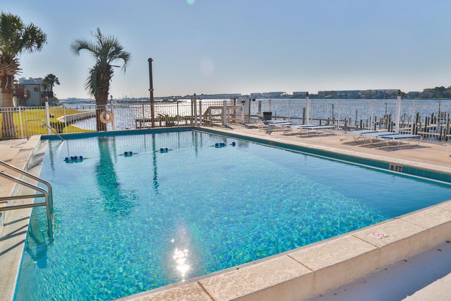 PRETTY PERFECT CONDO, 2 bedrooms, 2 baths with a view of the sound from your back patio.  Awesome amenities including a fun club house with pool table, ping pong, kitchen etc., tennis court, SPARKLING POOL, beach & boat dock. The unit is squeaky clean with an open floor plan. Rentals must be more than 30 days.