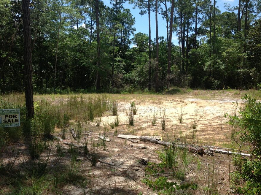 Great lot with possible bay views from 2+ floors. Cleared and ready to build with septic in place. High and dry with possible owner financing. Community boat launch right up the street. Close to Beaches, Seaside, 30A, Pier Park, Destin. Great school system! Additional lot next door available for large estate. Listing Broker/Licensee related to owner.