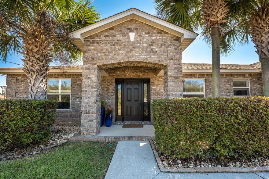 This turnkey, all brick home is just what you've been looking for! The open concept living is airy, spacious, and great for entertaining. The remodeled kitchen has a full granite slab island bringing you to the heart of the home. Luxury Vinyl Plank flooring throughout the home, LED Lighting, and Smart Home compatible can lights, are just a few of the many upgrades completed in 2019. The split bedroom floor plan allows for a large, private primary bedroom with ensuite bathroom offering separate shower & garden tub. The front bedroom has French doors so it can also be used as an office or gym. The oversized 2-car garage has upgraded overhead lighting, luxury garage screen, WiFi garage door, wired for 220V/50amp to be used for electric car or large power tools.