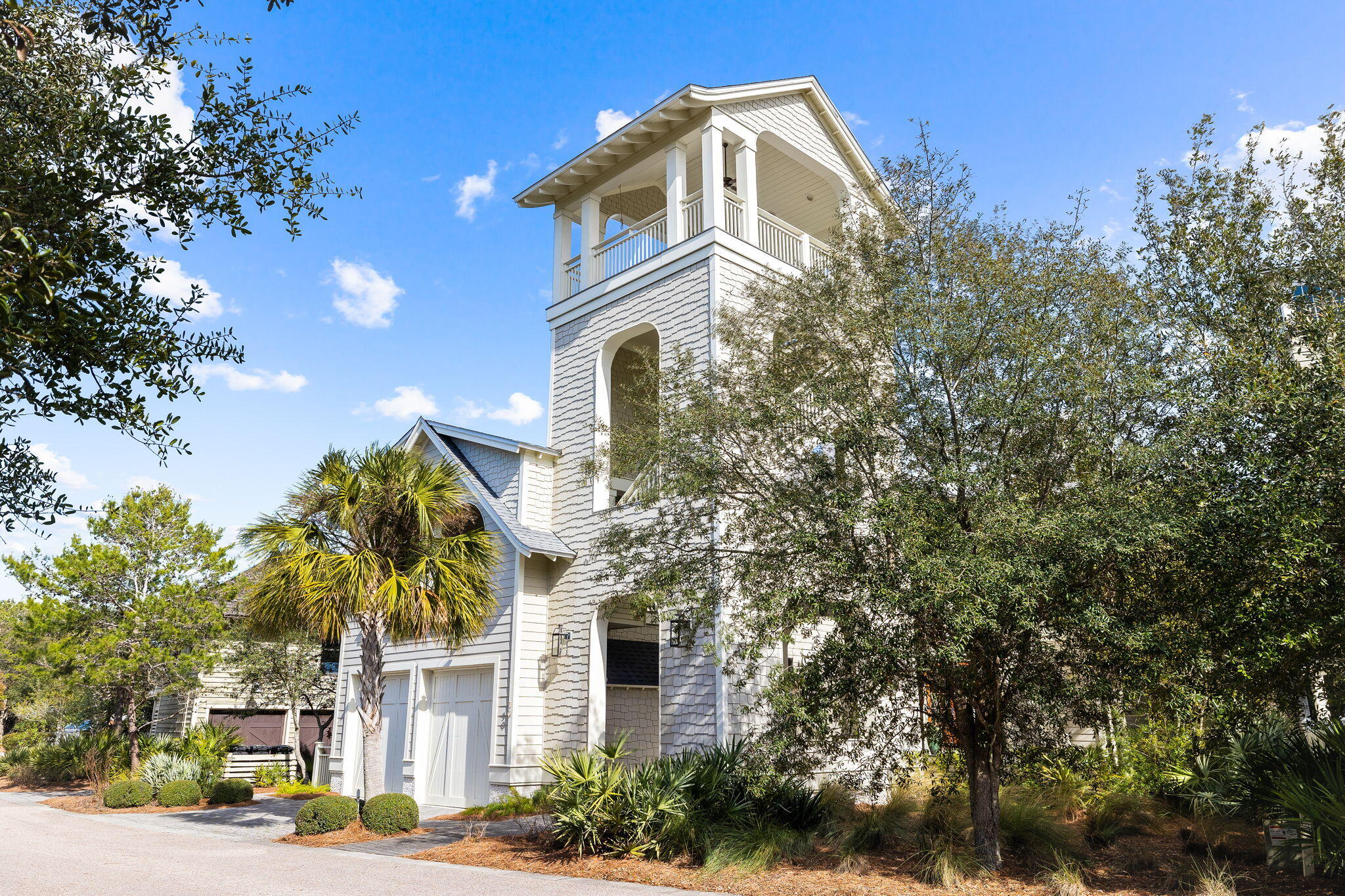 Nestled within WaterSound Beach, this refined home captures the essence of beach living while delivering gulf and coastal dune lake views. The creative design of architect Dawn Thurber captivates, from the entry boardwalk passing under the home's four-story tower to the front and rear porches that take advantage of the home's private position on a tree lined Watersound community park. The home's exterior provides a warm welcome through a private courtyard with bubbling water feature, landscaping native to the Florida panhandle and cascading crescent steps leading to the home's front door. Featured in ''Coastal Lifestyle'' magazine, the home's vaulted ceilings, white oak floors and nautical tongue-in-groove wall boards balance Nantucket coastal charm with casual elegance.