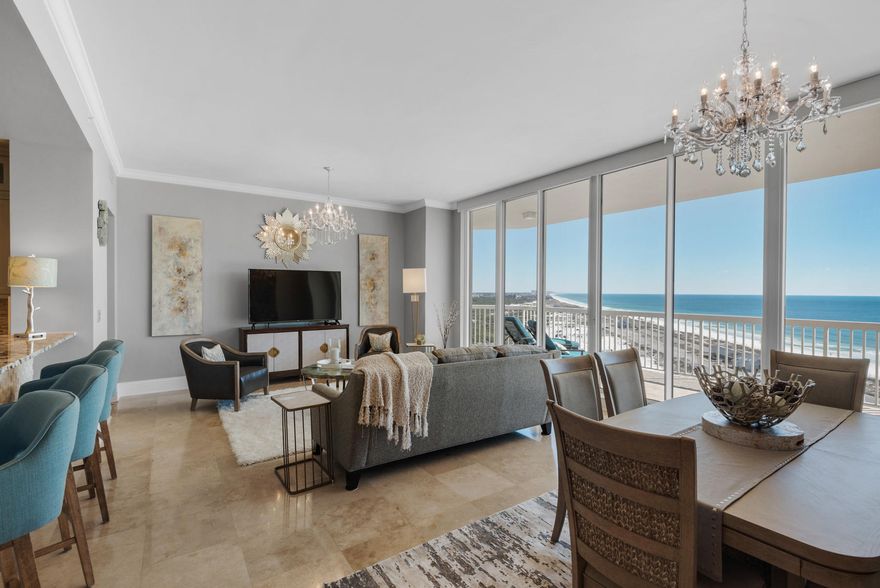 Incredibly gorgeous, totally renovated, 3 bedroom, 3 -1/2 bath penthouse with an oversized two car garage, two expansive terraces and miles of incredible views. St. Barth at Silver Shells is a premier short-term rental restricted luxury condo located next to Henderson Beach State Park providing endless unobstructed views down the eastern coastline of the Gulf of Mexico. The photos speak for themselves but rest assured, no expense was spared in this top to bottom renovation to include: polished travertine flooring in the foyer, living/dining area, kitchen, hallways, & stairway to the master; hardwoods in all bedrooms; new granite throughout; custom cabinets in kitchen, wet bar & master bath; custom backsplash & bar front; paint & crown molding; all new sinks & frameless shower enclosures,