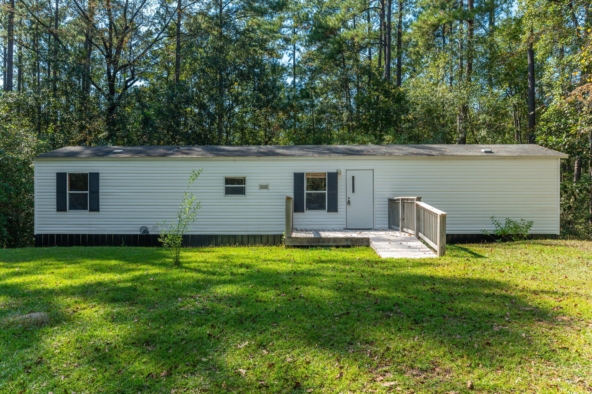 Price reduction and back on market no fault of seller! Fully furnished!! Cozy 3/1 oasis seller used as a getaway retreat surrounded by lush trees and nature sitting on almost 3 acres! There's a live creek that runs through the property AND its adjacent to the Florida National Forest, so the land is protected from future building on both sides. Imagine having breakfast on the back shaded deck watching the deer gallop past. This home is a dream come true! A diamond in the rough and a must see! Seller is motivated!