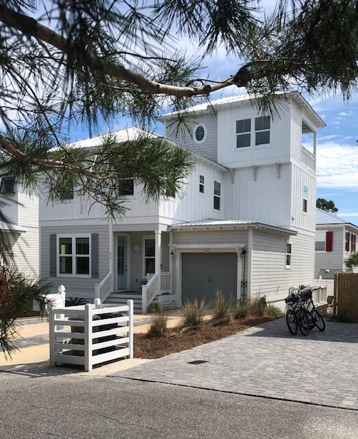 Beautiful newly constructed home in Blue Mountain Beach. It comes fully furnished and is located in a non HOA neighborhood. Enjoy the green space offered out the front of this home. Low expenses as this well built home has foam insulation throughout and on-demand hot water heater. Natural gas outdoor grill and professional series kitchen appliances.4 bedroom, 3.5 bath home with 2 laundry areas and 2 living/entertainment spaces. 1 1/2 tandem finished garage and large back raised porch and gas grill. 1st floor bedroom and full bathroom. 3rd floor has a indoor tv room with 1/2 bath, beer cooler cabinet and outdoor patio to watch sunrises and sunsets. This house has everything you will need to enjoy as a full time home or investment property.