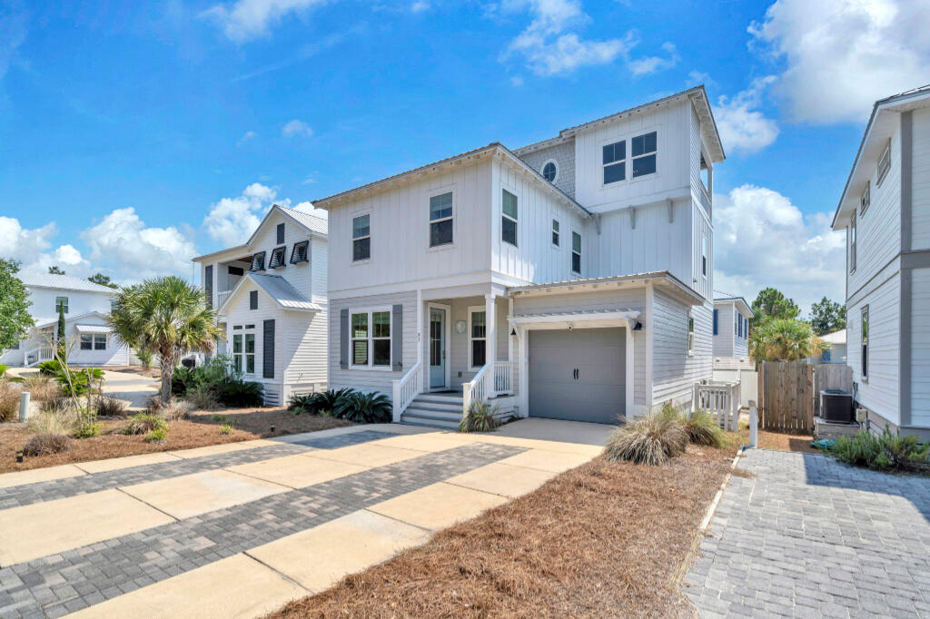 So many features for home in this price range. Beautiful newly constructed home in Blue Mountain Beach. It comes fully furnished and is located in a non HOA neighborhood. Enjoy the green space offered out the front of this home. Low expenses as this well built home has foam insulated throughout and on-demand hot water heater. Natural gas outdoor grill and professional series kitchen appliances.4 bedroom, 3.5 bath home with 2 laundry areas and 2 living/entertainment spaces. 1 1/2 tandem finished garage and large back raised porch and gas grill. 1st floor bedroom and full bathroom. 3rd floor has a indoor tv room with 1/2 bath, beer cooler cabinet and outdoor patio to watch sunrises and sunsets. This house has everything you will need to enjoy as a full time home or investment property.