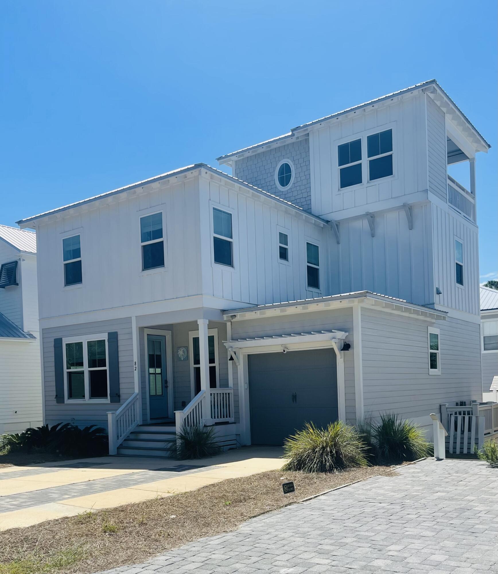 So many features for home in this price range. Beautiful newly constructed home in Blue Mountain Beach. It comes fully furnished and is located in a non HOA neighborhood. Enjoy the green space offered out the front of this home. Low expenses as this well built home has foam insulated throughout and on-demand hot water heater. Natural gas outdoor grill and professional series kitchen appliances.4 bedroom, 3.5 bath home with 2 laundry areas and 2 living/entertainment spaces. 1 1/2 tandem finished garage and large back raised porch and gas grill. 1st floor bedroom and full bathroom. 3rd floor has a indoor tv room with 1/2 bath, beer cooler cabinet and outdoor patio to watch sunrises and sunsets. This house has everything you will need to enjoy as a full time home or investment property.
