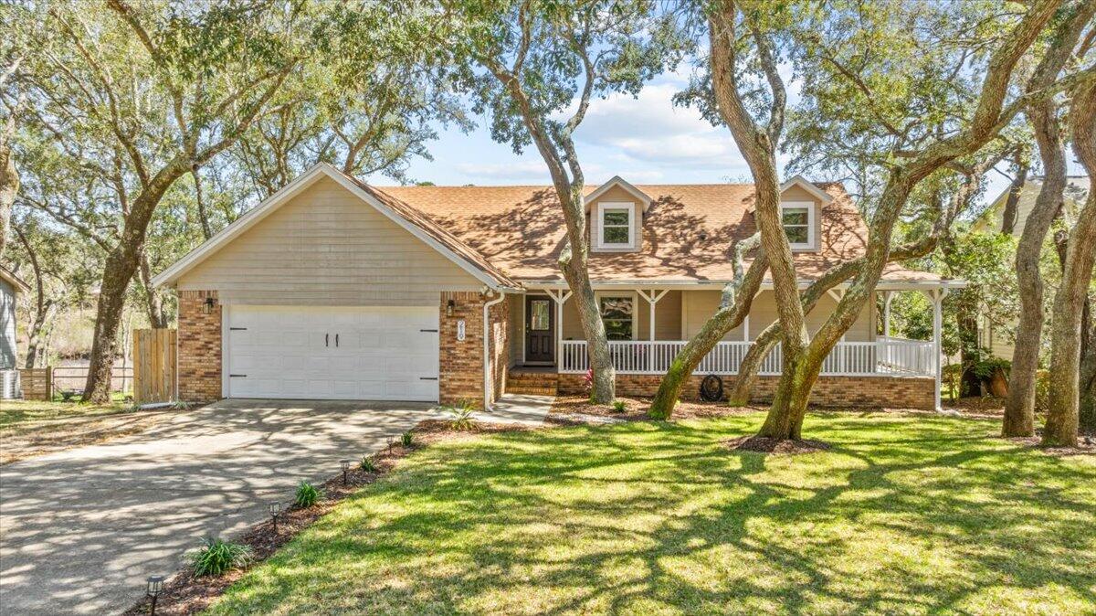 This beautifully updated 5-bedroom, 3-bathroom home in Bluewater Bay stands out with a private Mother in Law Suite, featuring 1 bedroom, a full kitchen, a full bath, and a private screened-in porch--all with a separate entrance for added privacy and flexibility!A charming front porch welcomes you into the home. Spacious living room boasts a cathedral ceiling and a cozy fireplace. Off the living room, you'll find a formal dining room and a sunroom with incredible views over the natural preserve. The kitchen features stainless steel appliances, granite countertops, and a breakfast bar. The large primary suite is a peaceful retreat, complete with a fully remodeled bathroom featuring a new double vanity, updated lighting, tile flooring, and a custom tiled shower with glass door. The remodeled hall bathroom also impresses with a new vanity, toilet, tile floors, fixtures, mirror, and lighting.
Private backyard oasis, complete with an upstairs deck- perfect for relaxing outdoors.
No HOA!
Recent Updates:
Brand New Water Heater (2025), Roof (2019), HVAC - Upstairs (2022) | Downstairs (2012)