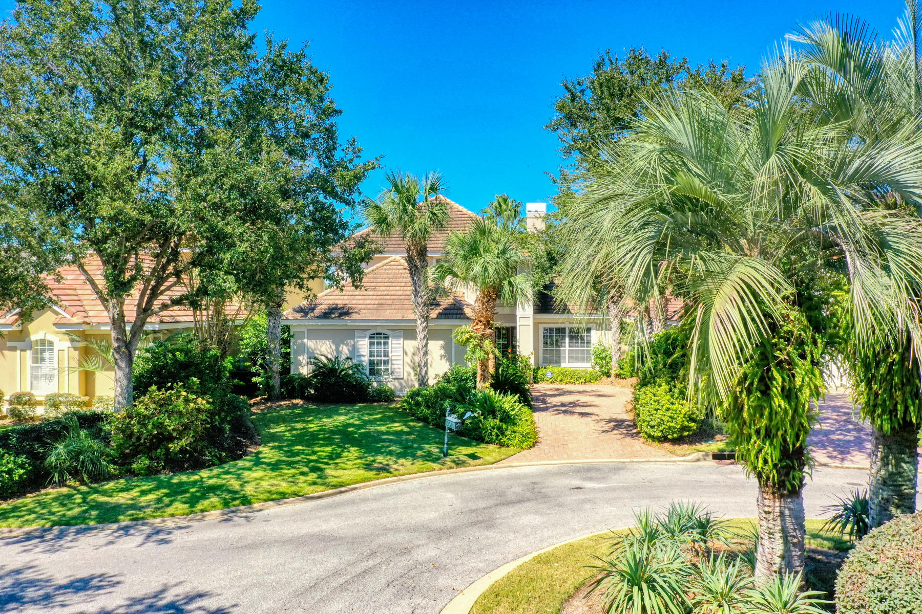 This Beautiful home in Regatta Bay offers luxurious landscaping and sits in a quiet cul-de-sac overlooking your very own private heated pool with hot tub and lake. The large master suite is on the main floor with two guest rooms and a large game room/media room upstairs which has a balcony that also overlooks the pool and lake. Large open floor plan features a home office at the entry and custom built-ins around the gas fireplace in the family room. The open living/kitchen area allows for great entertaining flowing to the outside screened in lanai and pool area. Regatta Bay is a beautifully landscaped Golf Course Community and the course is rated among the top in the state. Amenities include tennis courts, pickle ball courts, a large Olympic size pool, kiddie pool and playground, walking trails, nature preserves and Club House. Community is in close proximity to great shopping and dining, and it's just a short golf cart ride to the Gulf of Mexico, Destin Commons, Whole Foods, Lulu's, Legendary Marina and more!