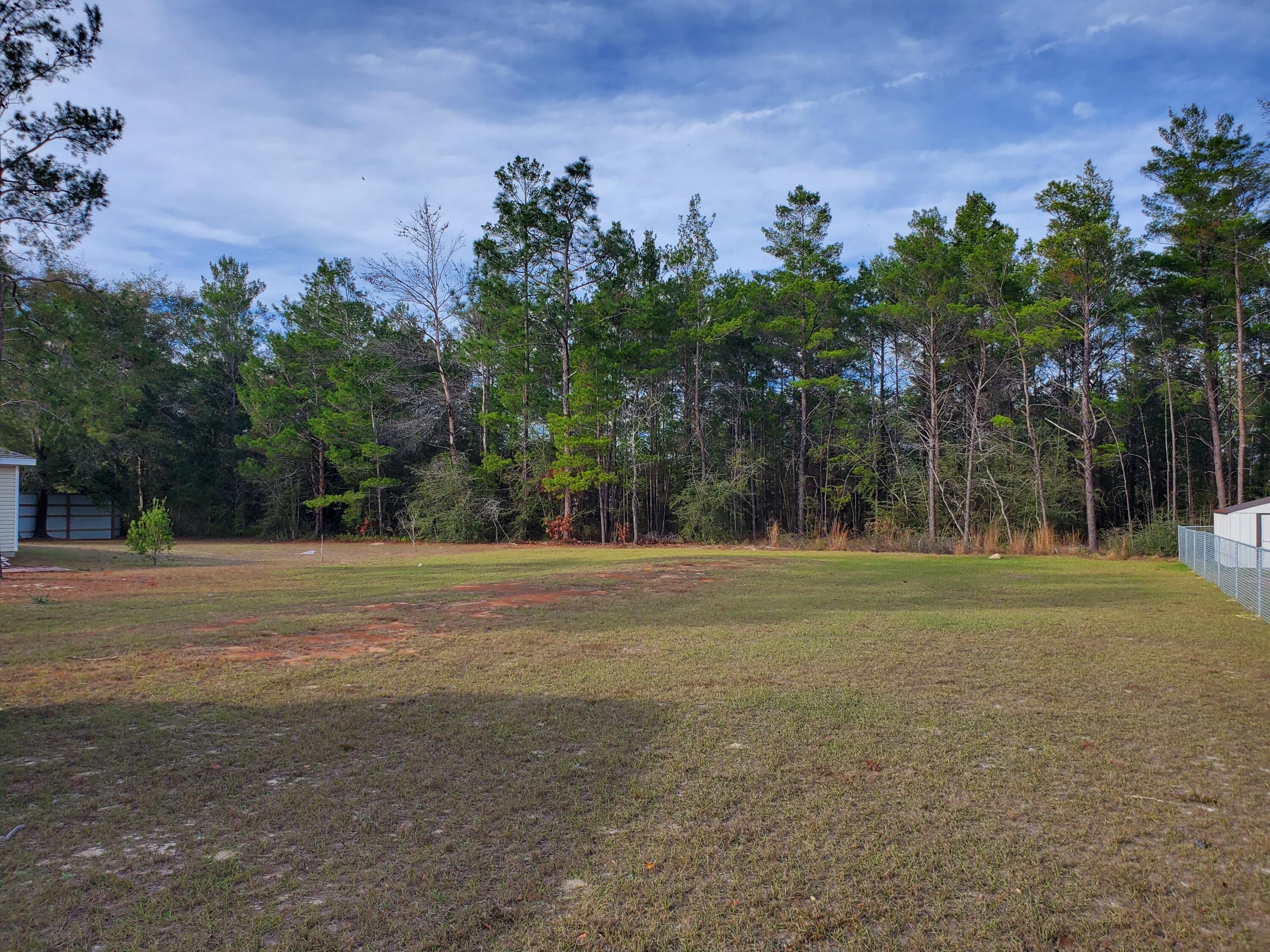 Your Dream Oasis Awaits in Mossy Head, Florida! Discover a prime 1/4 acre cleared lot in Mossy Head, Florida, offering the perfect blend of tranquility and convenience. Nestled in this charming rural community. Water and Power Ready! Save time and money with a cleared lot and water tap already in place. Chelco Power will connect you to nearby power pole, making your building process a breeze. Already in place is a 16' X 76' pad for single wide home (more can be added if needed) Your canvas awaits, design your ideal retreat, cultivate a garden, or create your perfect dwelling - the choice is yours! Location Perfection! Situated near I-10, enjoy easy access for commuters while relishing the serenity of rural living. Explore the community park or tee off at the nearby golf course, , all just moments away. Mossy Head is a rapidly growing community. This lot offers both personal and financial potential. This Mossy Head lot isn't just land; it's your key to a brighter future. Contact us today to seize this opportunity.