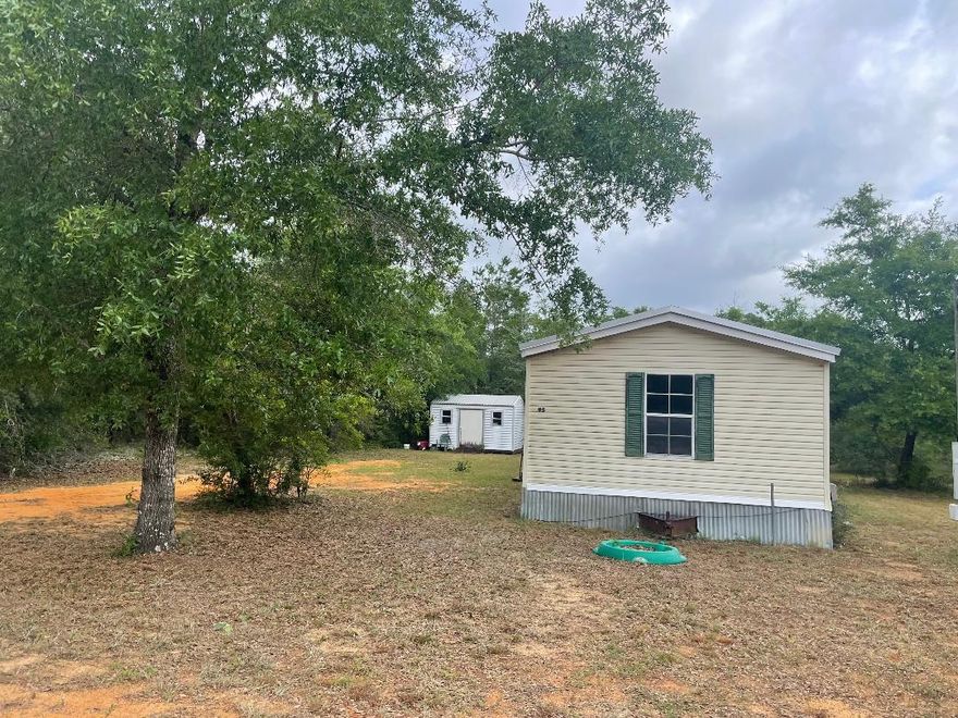 3 bedroom 2 bath single wide home. Master bath has separate shower and a garden tub with a walk-in closet. Living room includes a wood burning fireplace. Owner stated she hasn't ever used it.  two additional bedrooms are at the opposite end from the master bedroom. The layout of this home feels larger than it actually is. Perfect place for an investor/flipper. Home could use new appliances, counter tops, flooring and paint. Home had a RE-roof (metal over shingles) installed 9/25/2020. Home being sold as is. Cash or Conventional loan only.