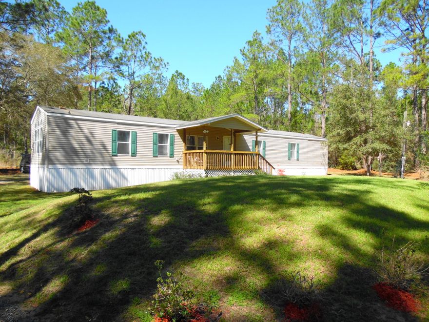 A great location if you work in south Walton County, Freeport, or even Ft. Walton Beach..located between Niceville and Freeport on Hwy 20, in the Portland community,this 4 bedroom, 2 bath, 1999 single wide mobile home with add-on den and 4th bedroom is perfect! This home sits on appx. one-half acre and is within 1200 from Alaqua Park that includes a family swimming area with picnic area and as well as a boat launch. From this boat launch you can access Choctawhatchee Bay and the Gulf of Mexico. Kitchen has island and breakfast nook area. Refrigerator, stove and dishwasher, washer/dryer included in the sale. Large living room with den 12x20 den with exit, and large walk in closet for the 4th
