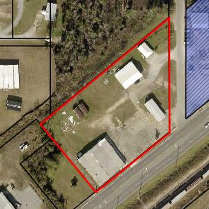 2401 US HWY 231 is 2.21 commercial acres located on the main highway that tourists use to travel into town to the world's most beautiful beaches.  $50,000 worth of Architectural and Engineering services included! There are three buildings on the property, two of them are on a month to month lease generating a total of $2,900 a month. Florida Department of Transportation traffic count is 32,500 a day.