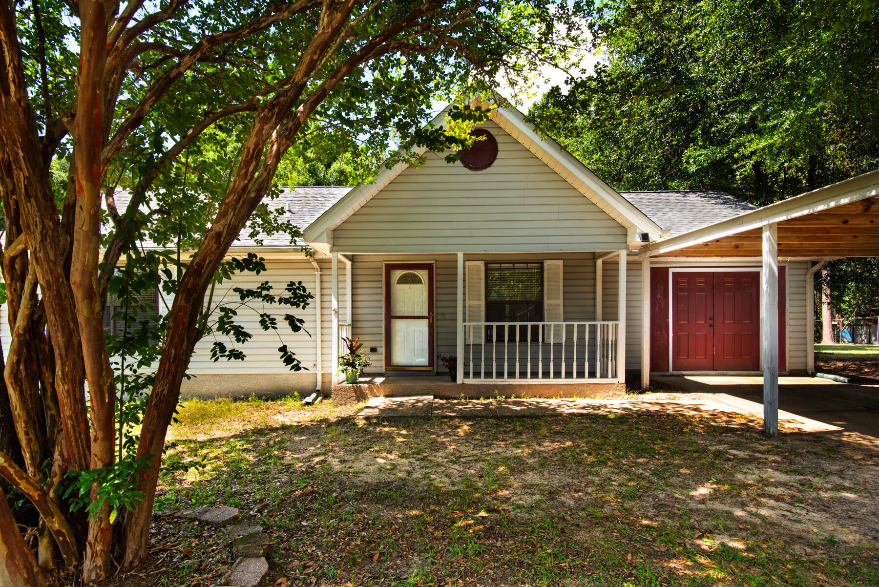 VA Assumable Loan. Located SOUTH OF I-10! This 3 bedroom 1.5 bath home on a 0.39 acre lot has a 2022 three dimensional shingle roof, a 2022 AC and gas furnace, 2023 septic system, newer paint, newer LVP flooring, as well as some new ceiling fans and light fixtures. The home offers a spacious living room, large open kitchen with dining area, primary bedroom with large closet and bathroom access. There are two additional bedrooms and a half bathroom located in the hall for guests. Don't miss the HUGE bonus room that could be used for many purposes: office, tv room, recreation room/pool table, indoor gym etc. The large lot offers a spacious front and backyard with mature trees, outdoor patio, and fence. The driveway has covered parking for 3 cars. Property is being sold As Is.